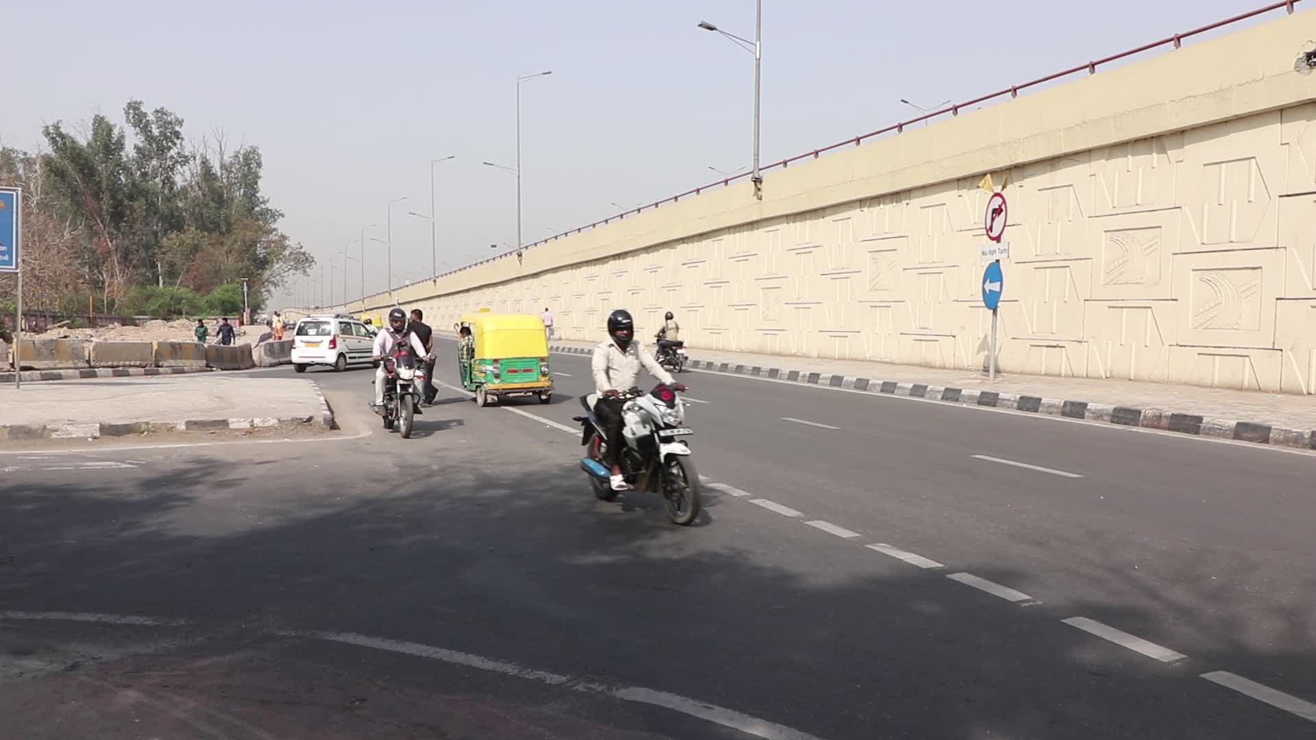Bike riders taking wrong direction risking lives in New Delhi, India