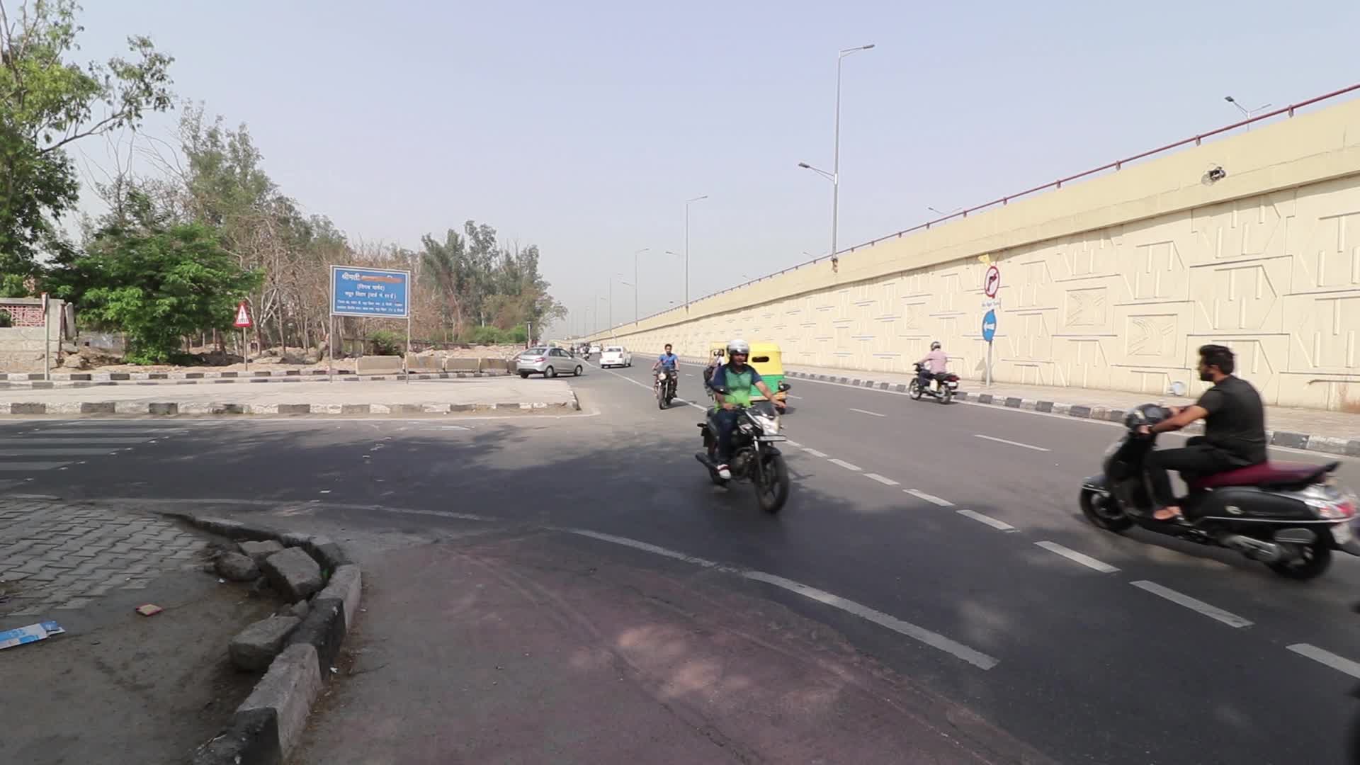 Bike riders taking wrong direction risking lives in New Delhi, India