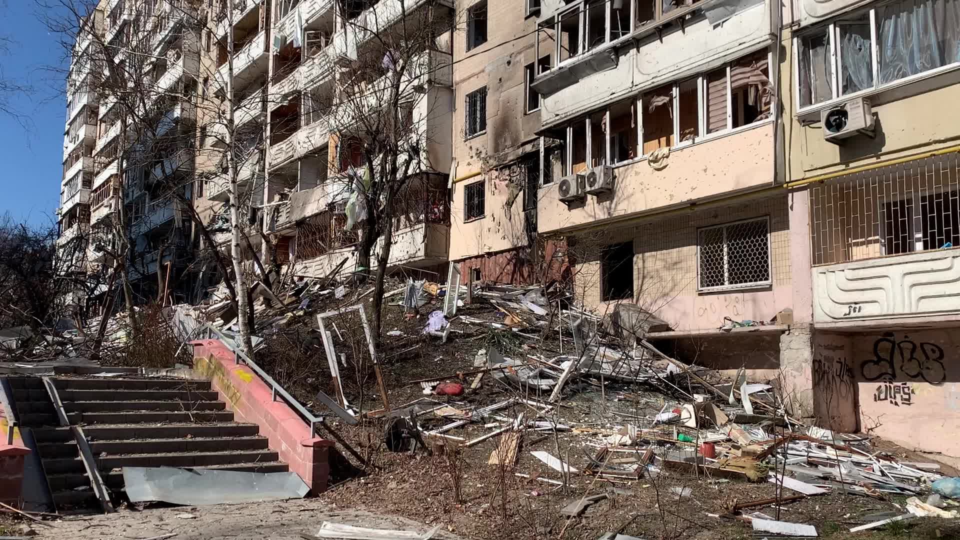 Damaged residential building in Kyiv hit by Russian shells