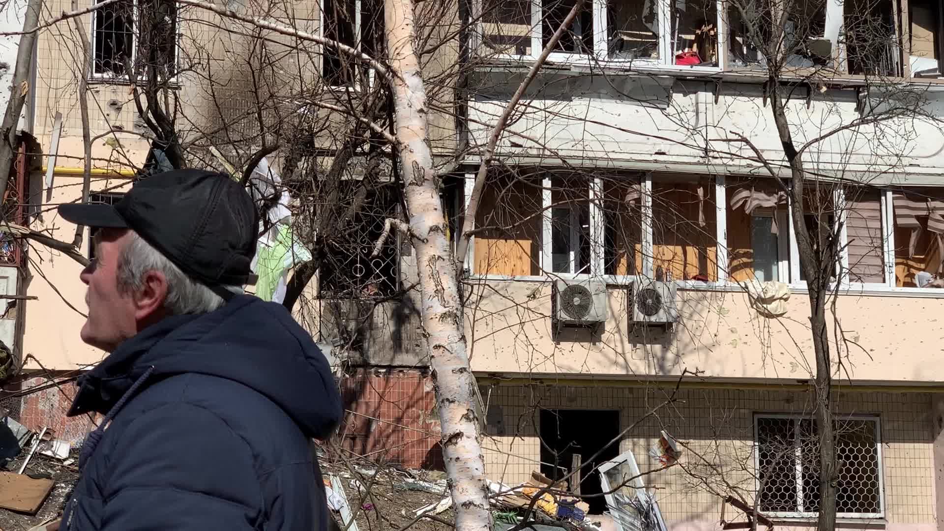 Damaged residential building in Kyiv hit by Russian shells