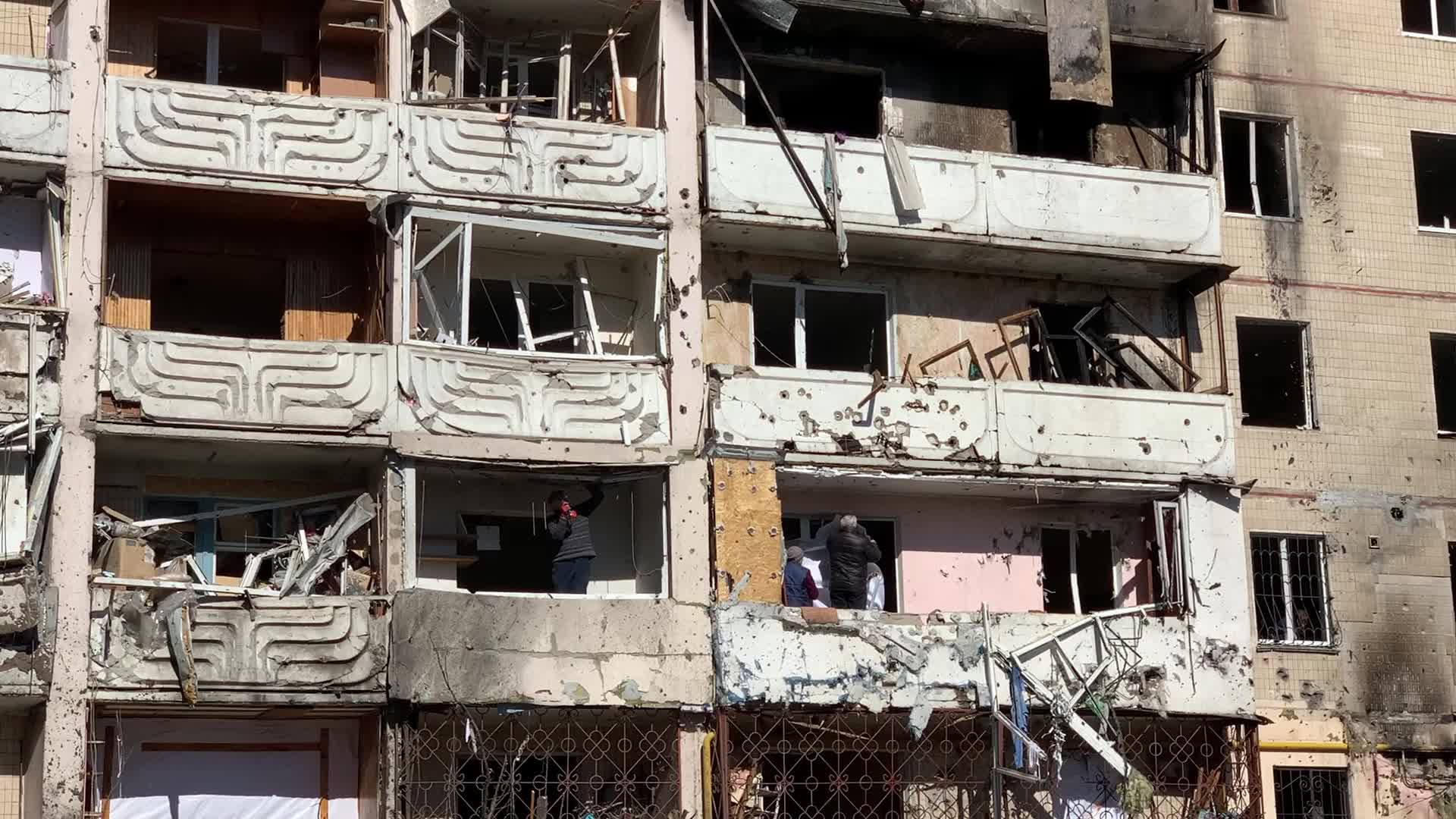 Damaged residential building in Kyiv hit by Russian shells