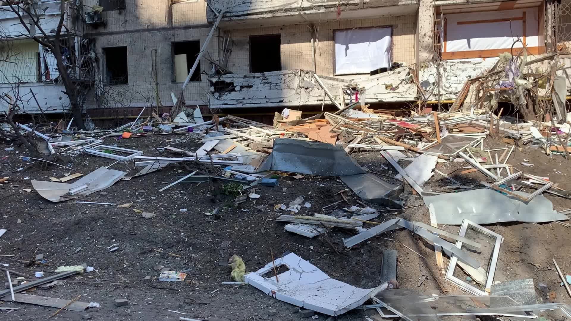 Damaged residential building in Kyiv hit by Russian shells