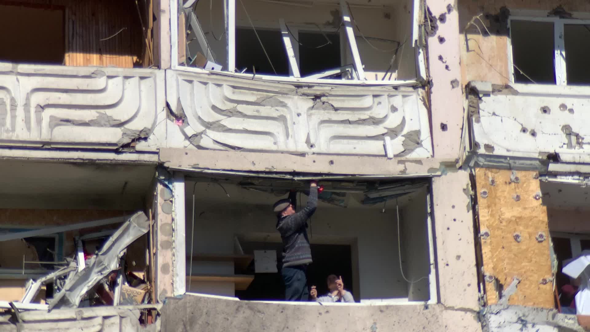 Damaged residential building in Kyiv hit by Russian shells