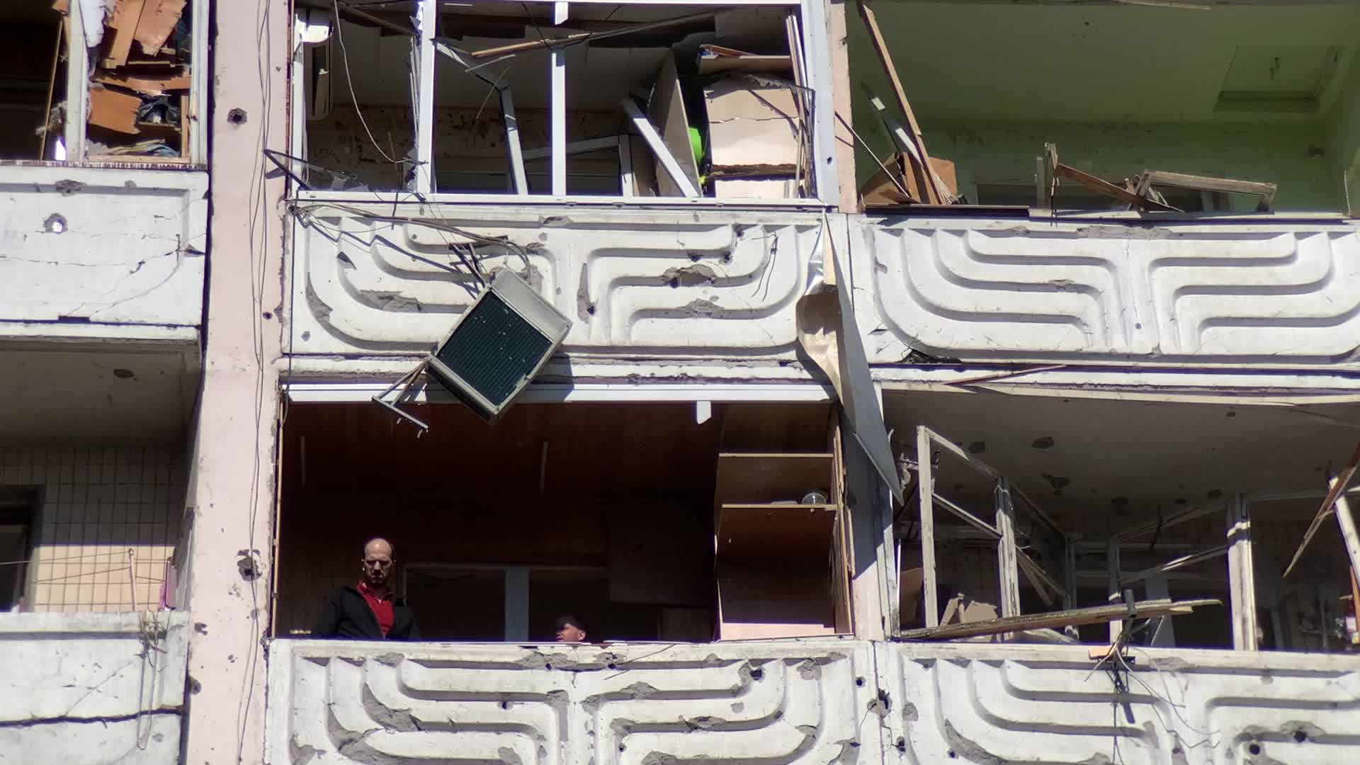 Damaged residential building in Kyiv hit by Russian shells