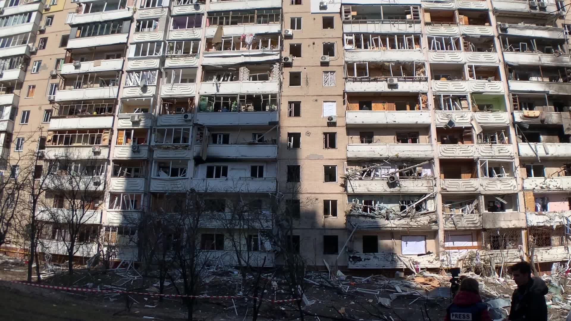 Damaged residential building in Kyiv hit by Russian shells