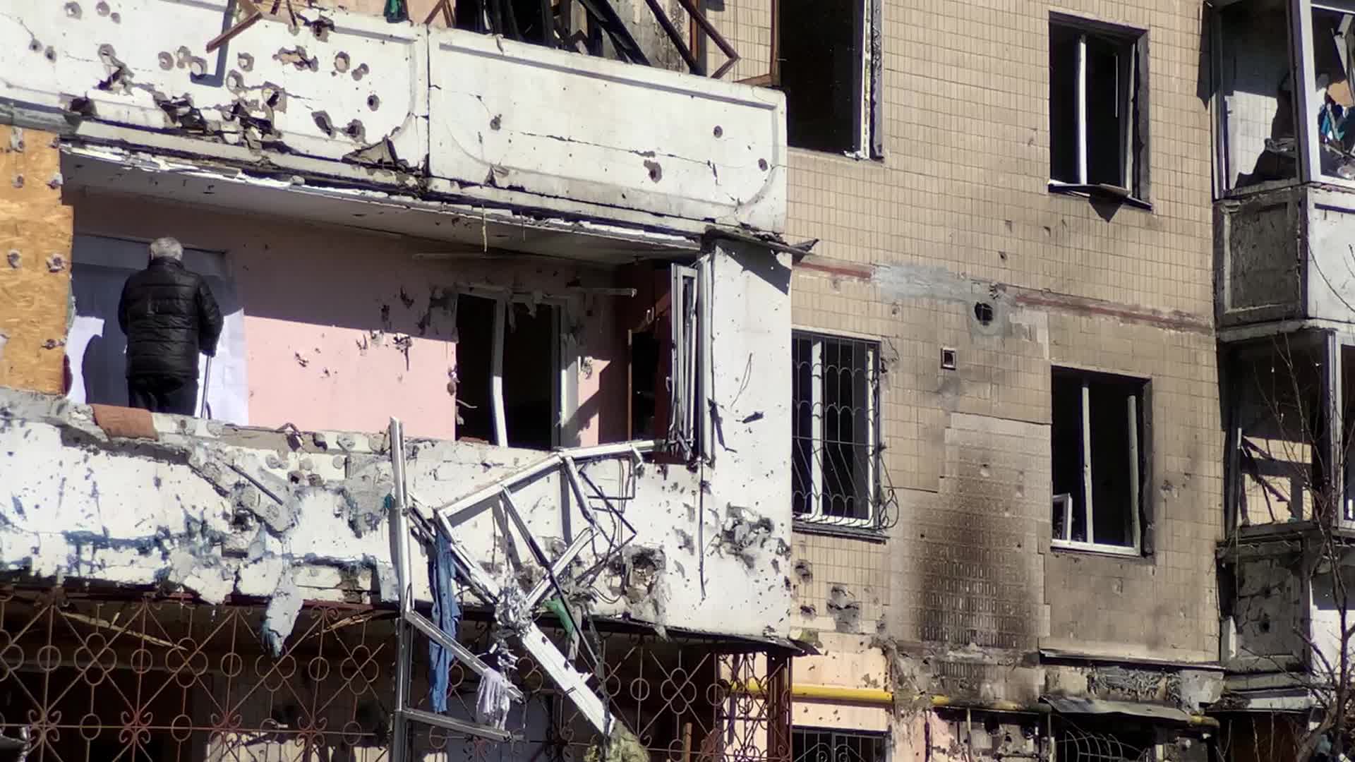 Damaged residential building in Kyiv hit by Russian shells