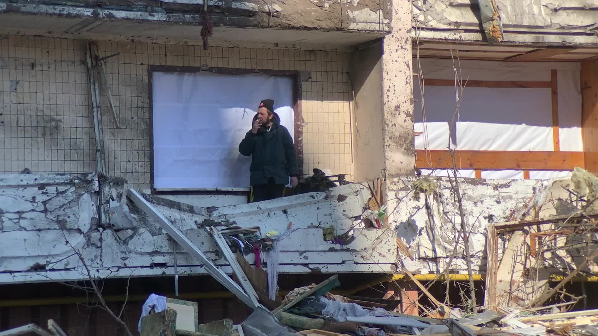 Damaged residential building in Kyiv hit by Russian shells