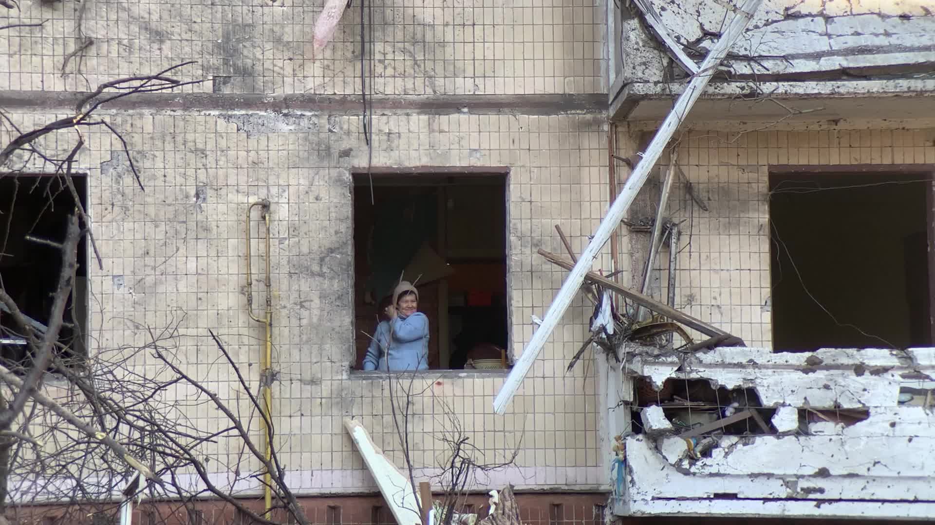 Damaged residential building in Kyiv hit by Russian shells