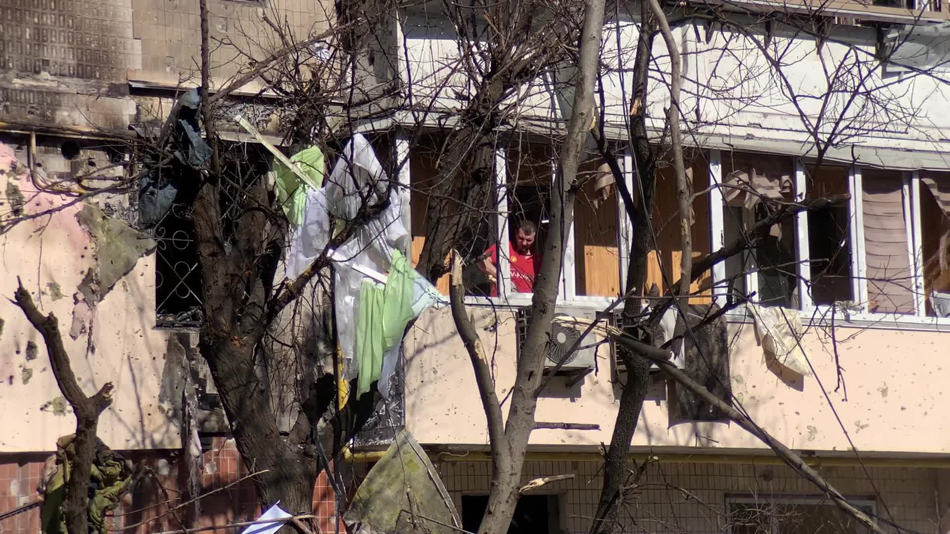 Damaged residential building in Kyiv hit by Russian shells