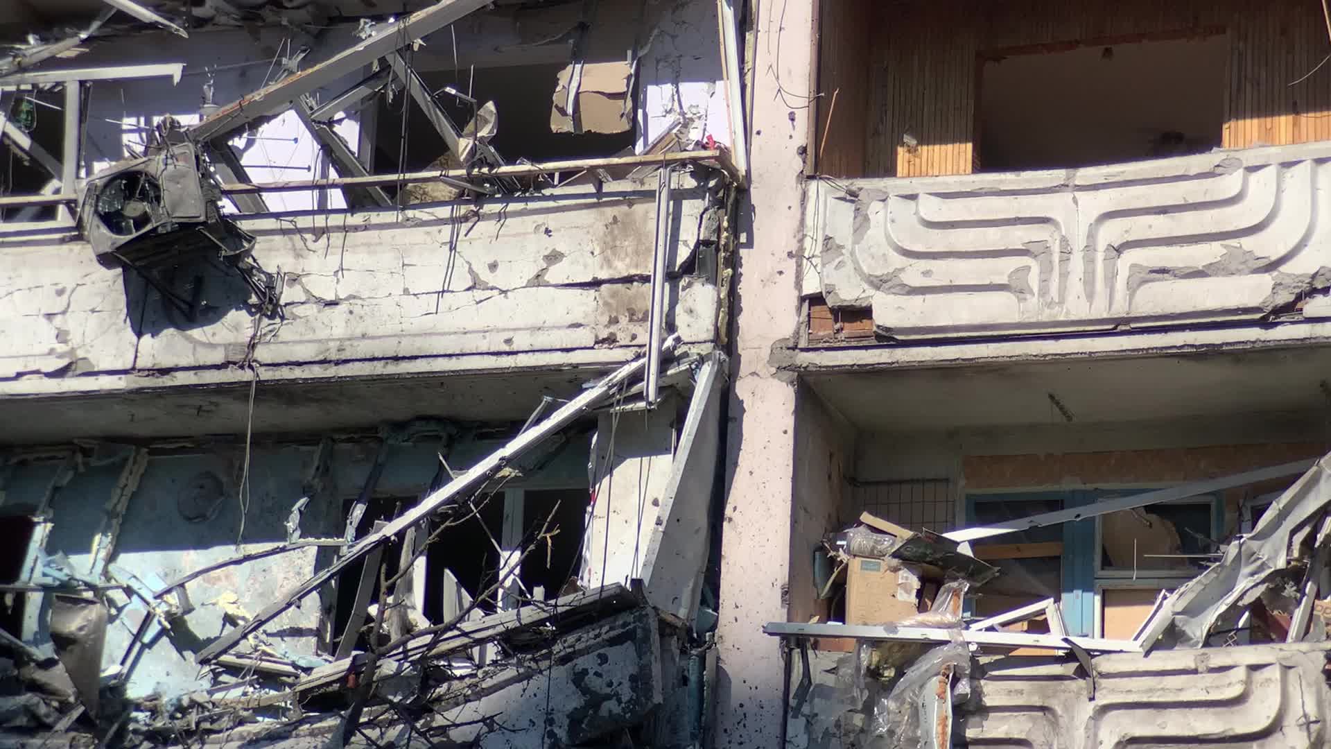 Damaged residential building in Kyiv hit by Russian shells