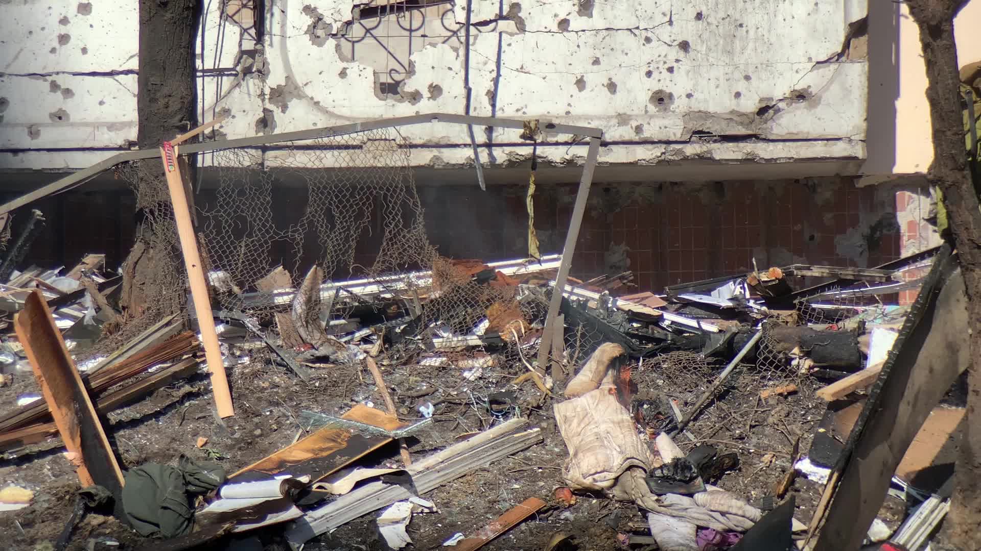 Damaged residential building in Kyiv hit by Russian shells
