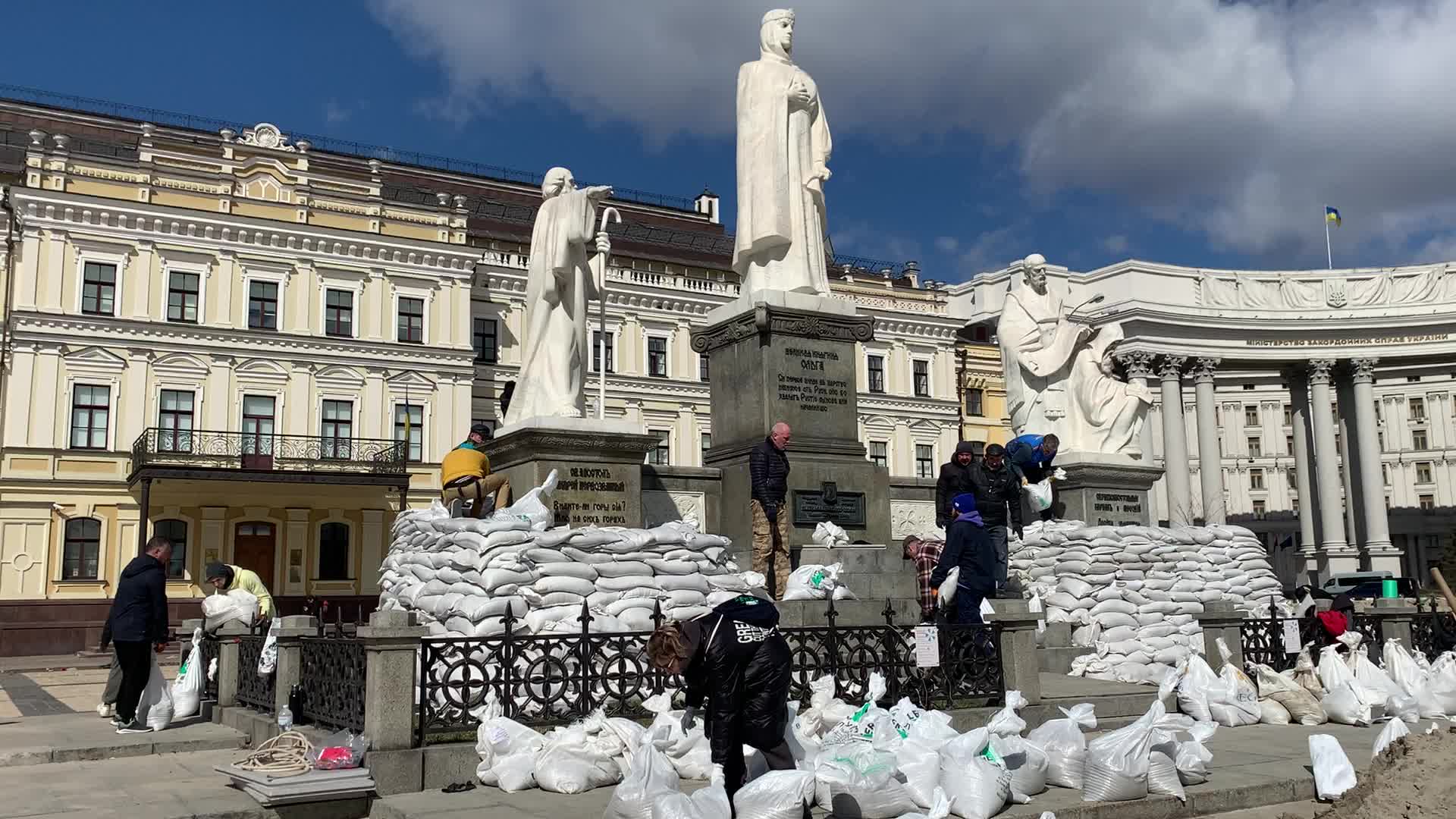 Communal workers protect a monuments in center of Kyiv as Russia's invasion of Ukraine continues