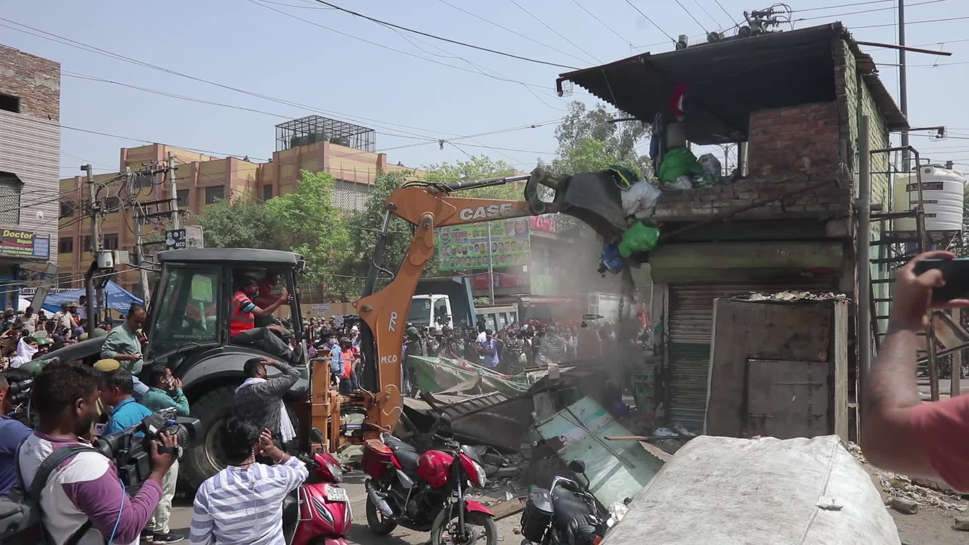 Demolition drive at the site of communal violence in New Delhi.