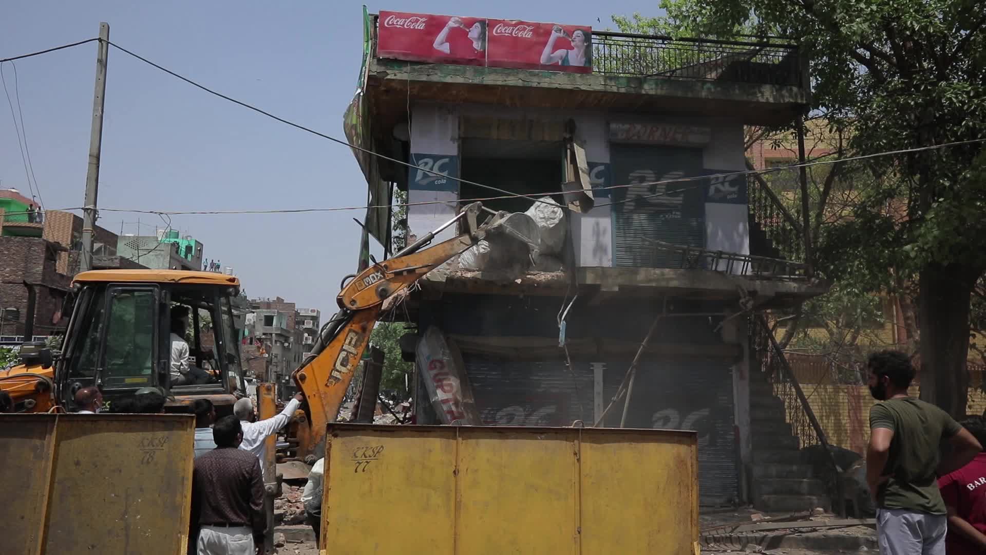 Demolition drive at the site of communal violence in New Delhi.