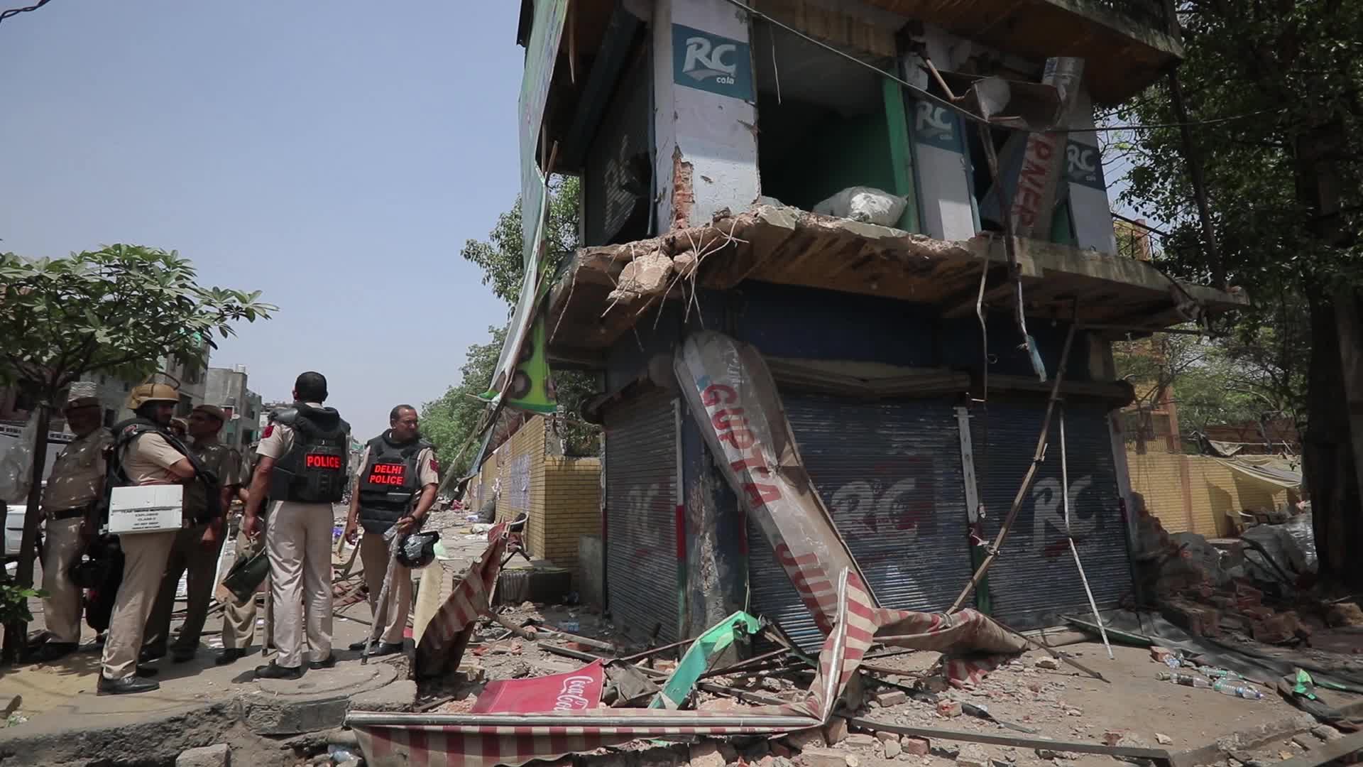 Demolition drive at the site of communal violence in New Delhi.