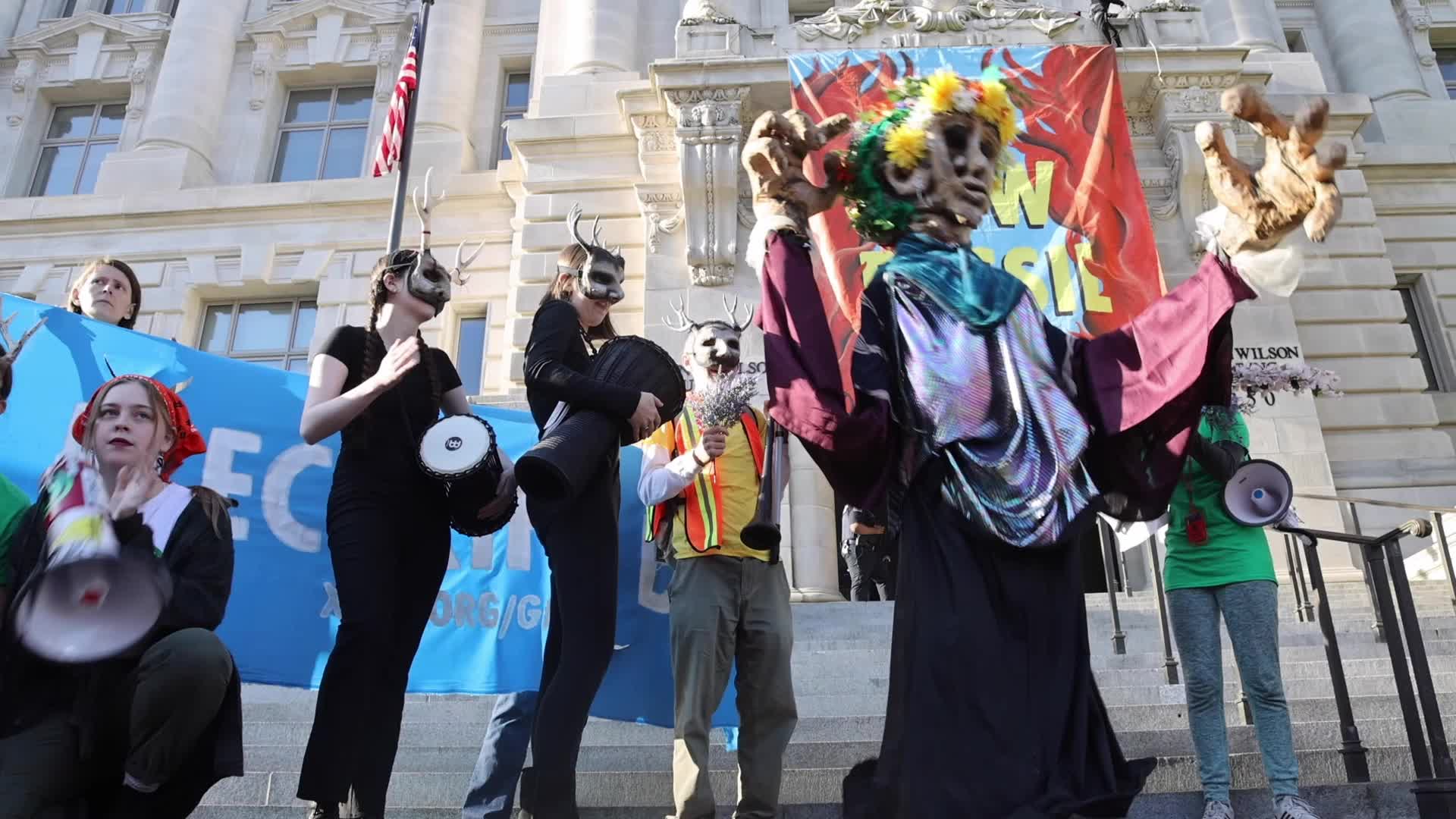 Climate protestors hold Earth Day rally and march