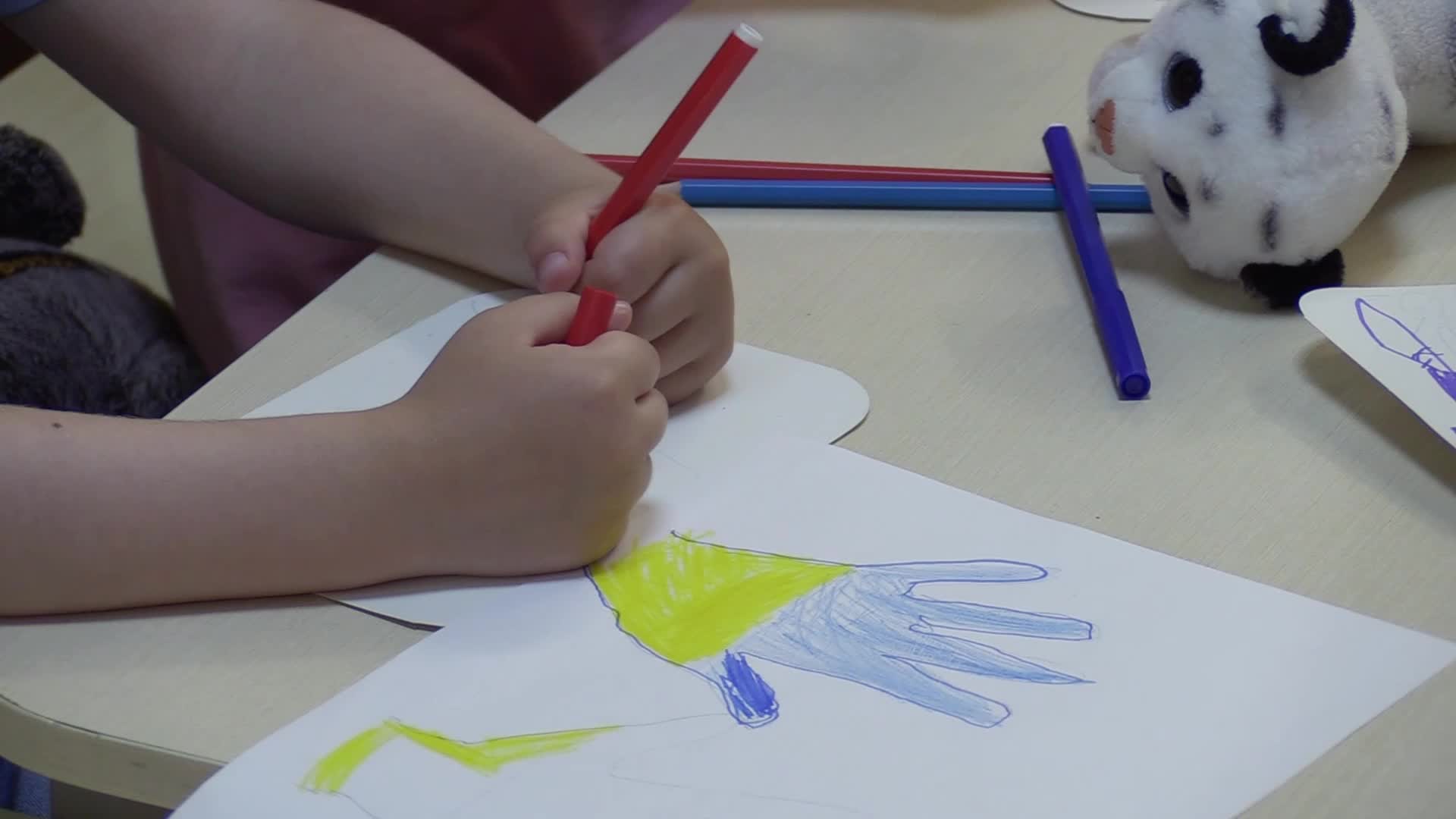 Ukrainian displaced children draw pictures to make chevrons for Ukrainian soldiers in Odesa, amid Russian invasion in Ukraine