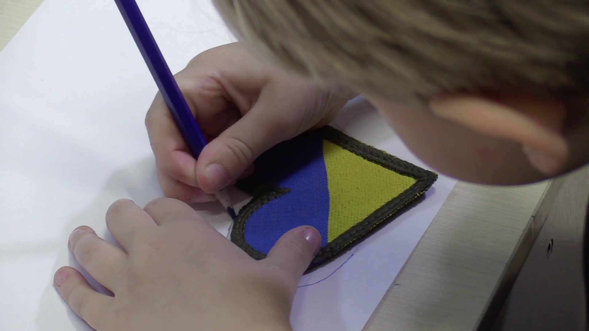 Ukrainian displaced children draw pictures to make chevrons for Ukrainian soldiers in Odesa, amid Russian invasion in Ukraine