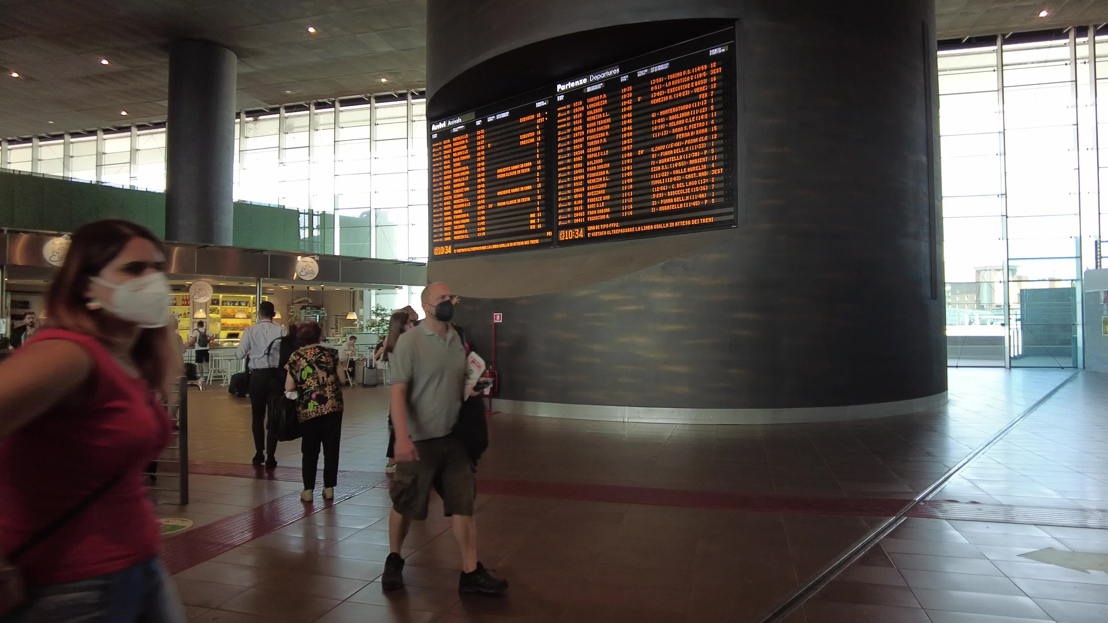 People and travelers in Tiburtina train station in Rome, Italy