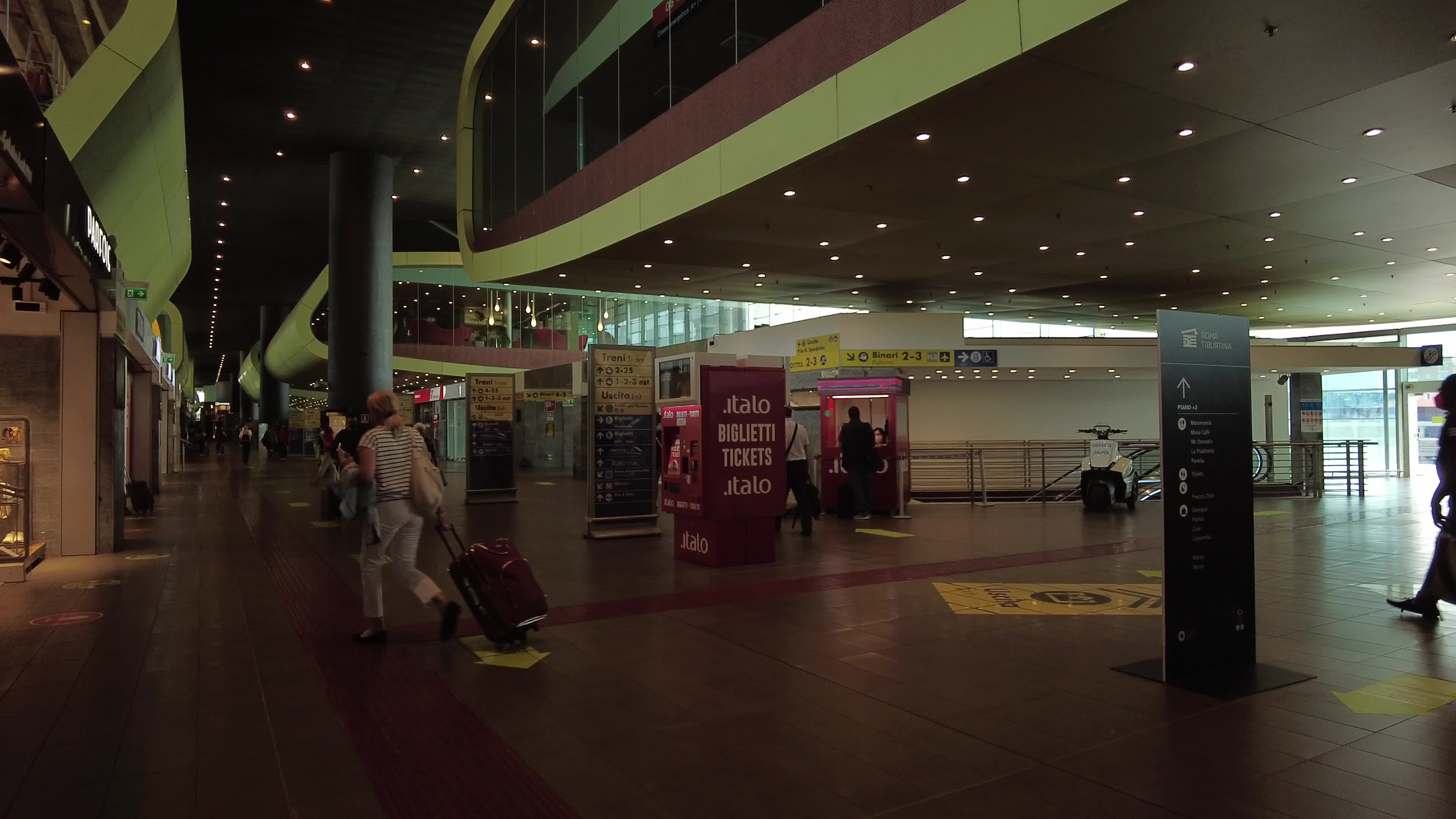 People and travelers in Tiburtina train station in Rome, Italy