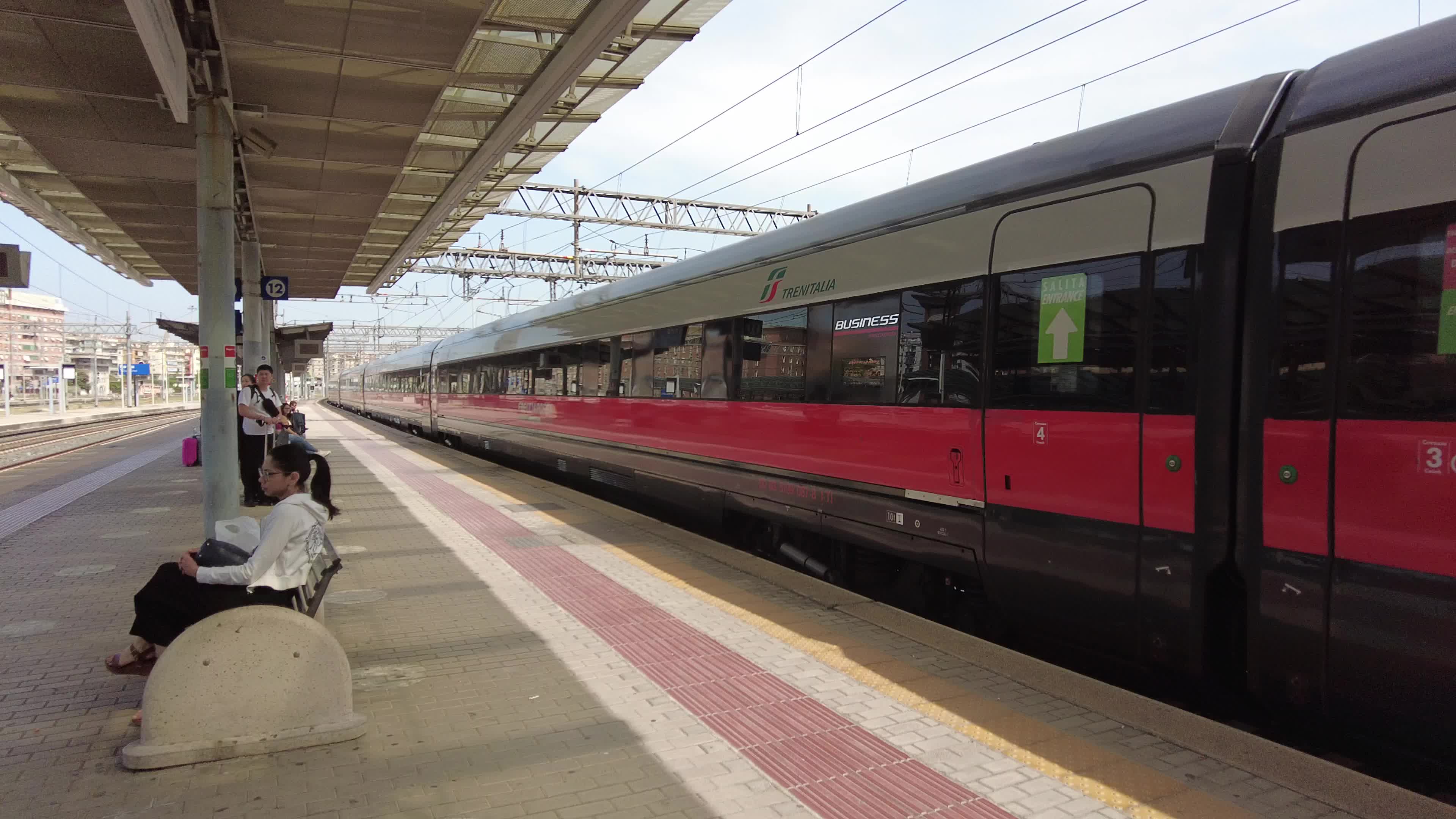 People and travelers in Tiburtina train station in Rome, Italy