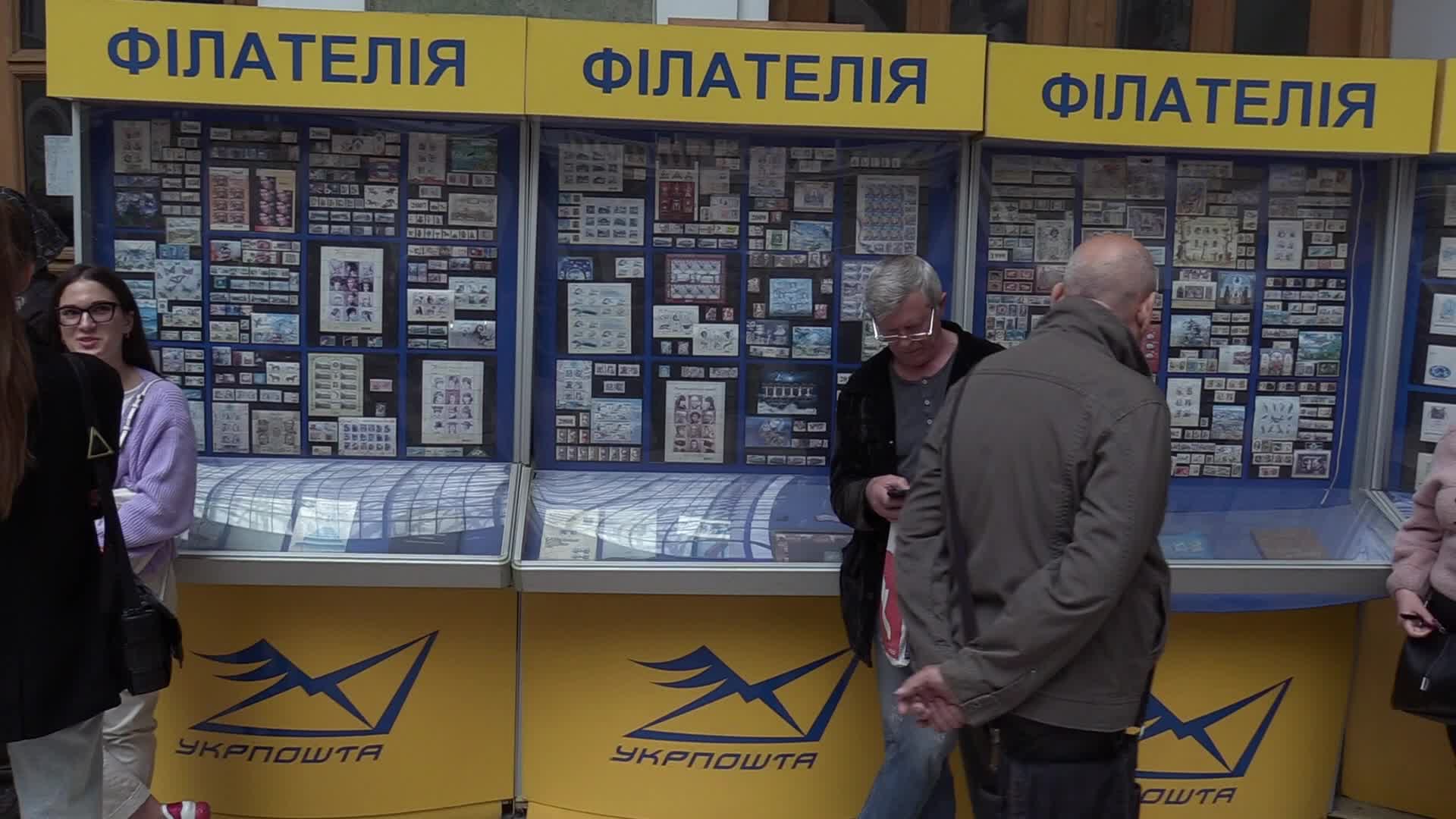 Ukrainians queue to buy a new set of postal service stamps dedicated to the sinking of Russian warship, in Odesa
