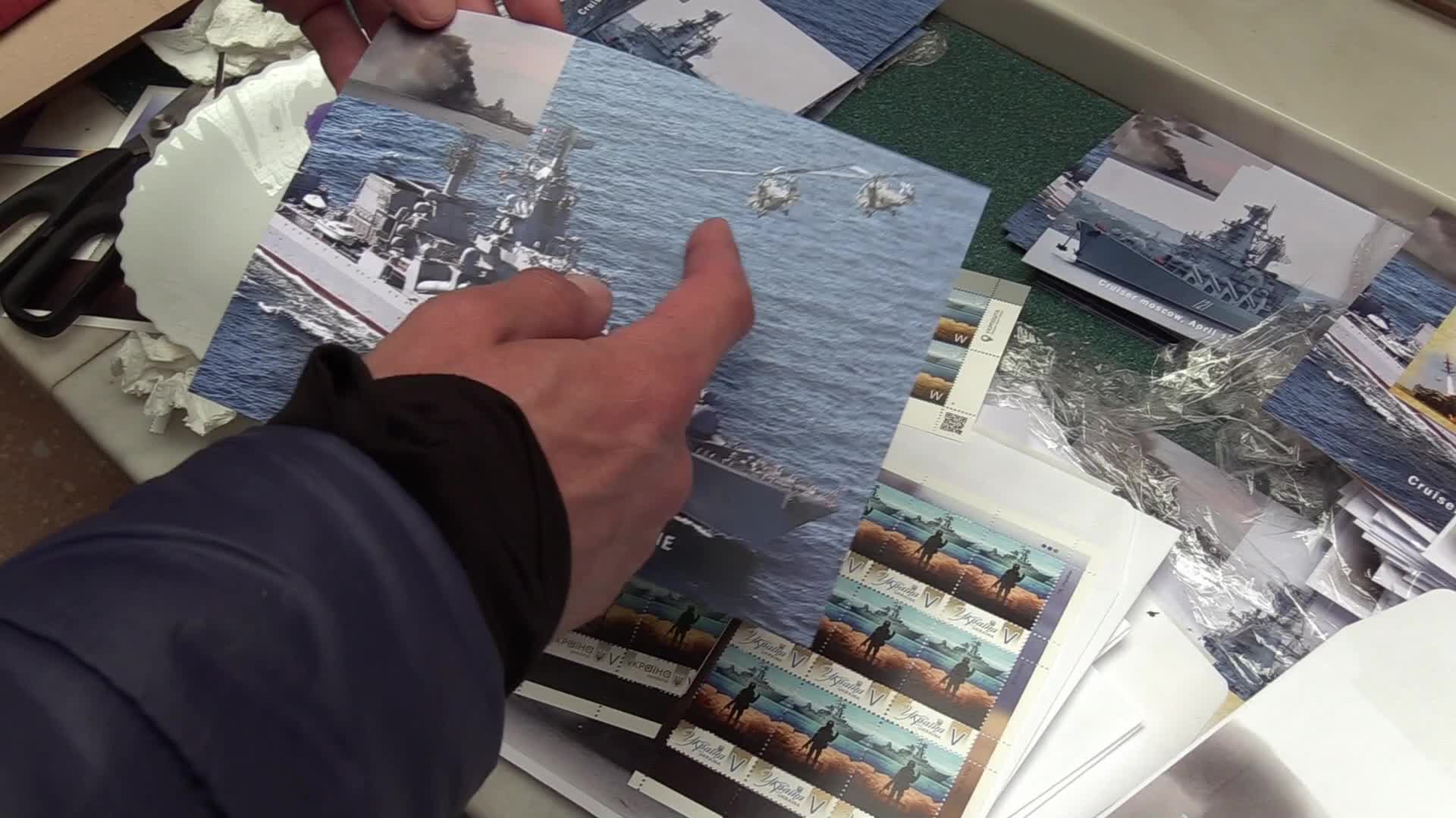 Ukrainians queue to buy a new set of postal service stamps dedicated to the sinking of Russian warship, in Odesa