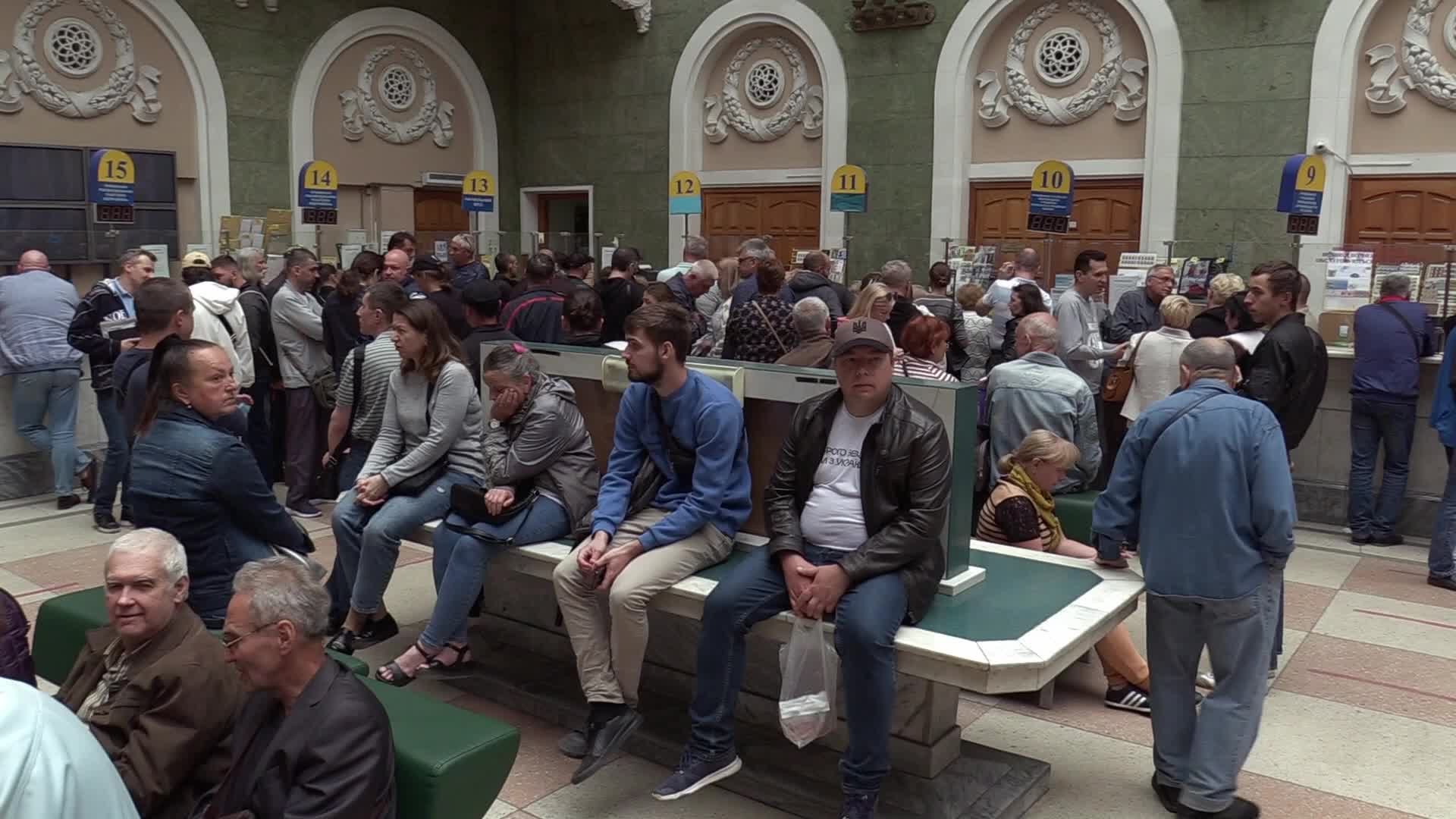 Ukrainians queue to buy a new set of postal service stamps dedicated to the sinking of Russian warship, in Odesa