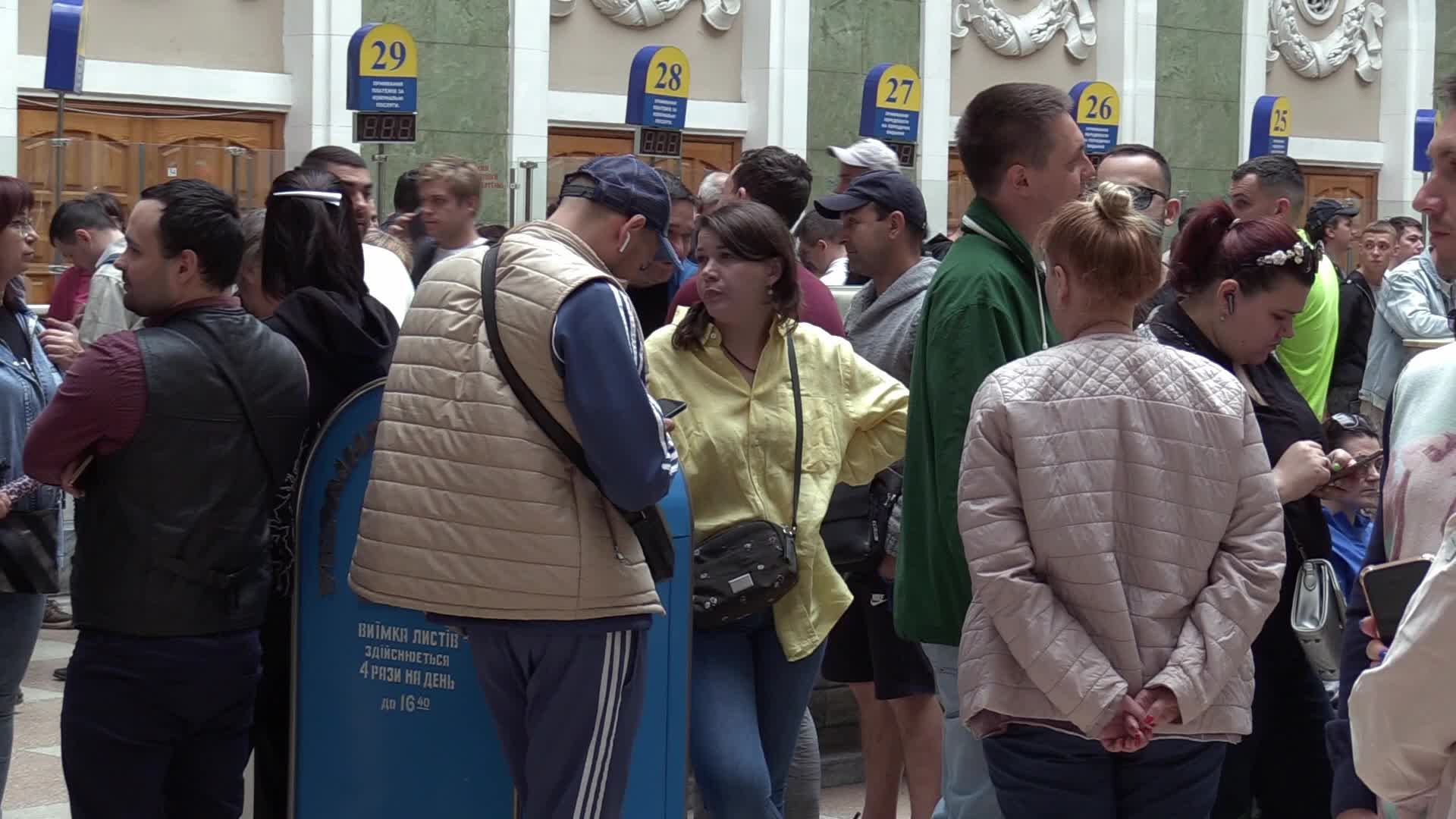 Ukrainians queue to buy a new set of postal service stamps dedicated to the sinking of Russian warship, in Odesa
