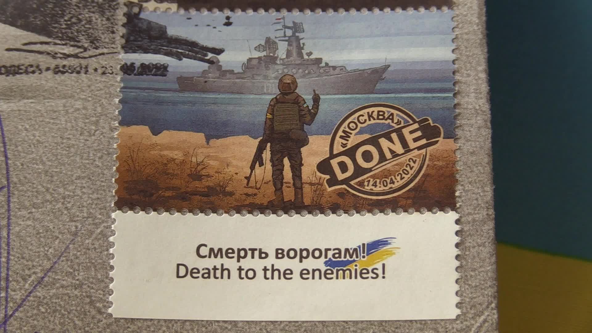 Ukrainians queue to buy a new set of postal service stamps dedicated to the sinking of Russian warship, in Odesa
