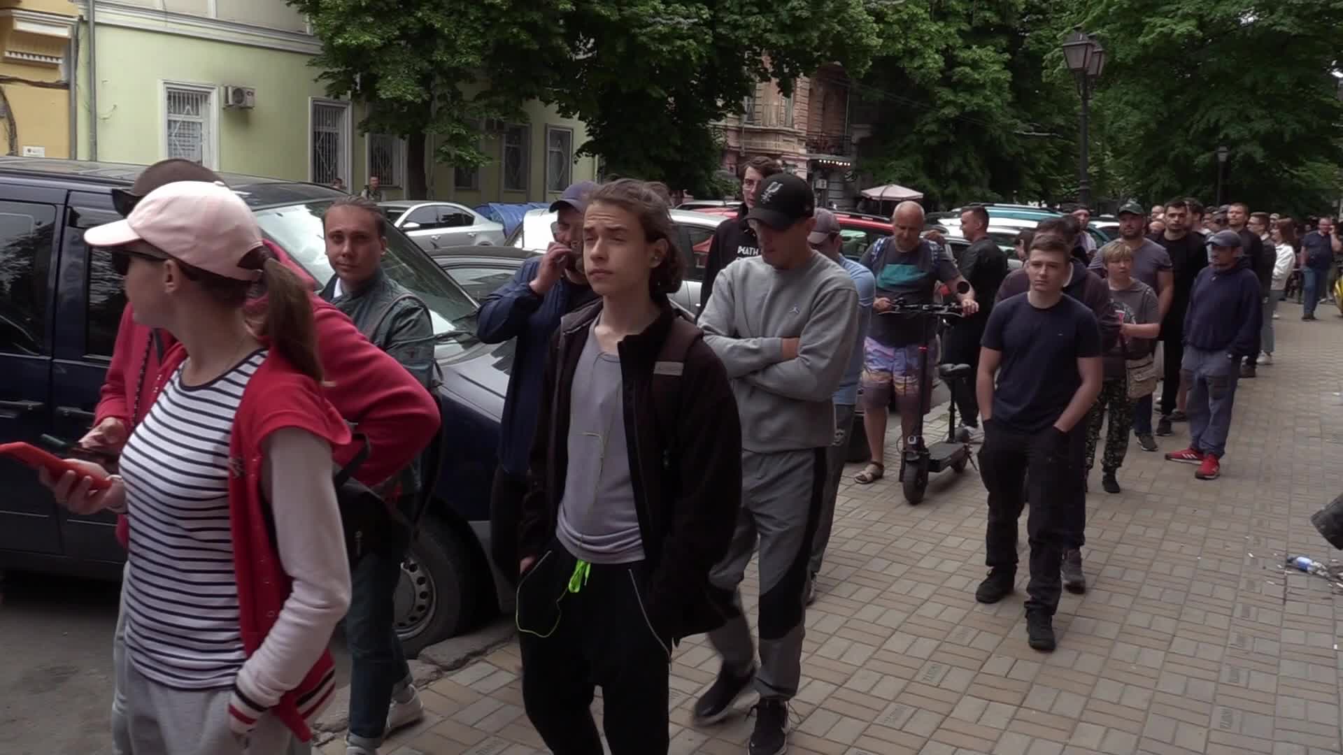 Ukrainians queue to buy a new set of postal service stamps dedicated to the sinking of Russian warship, in Odesa