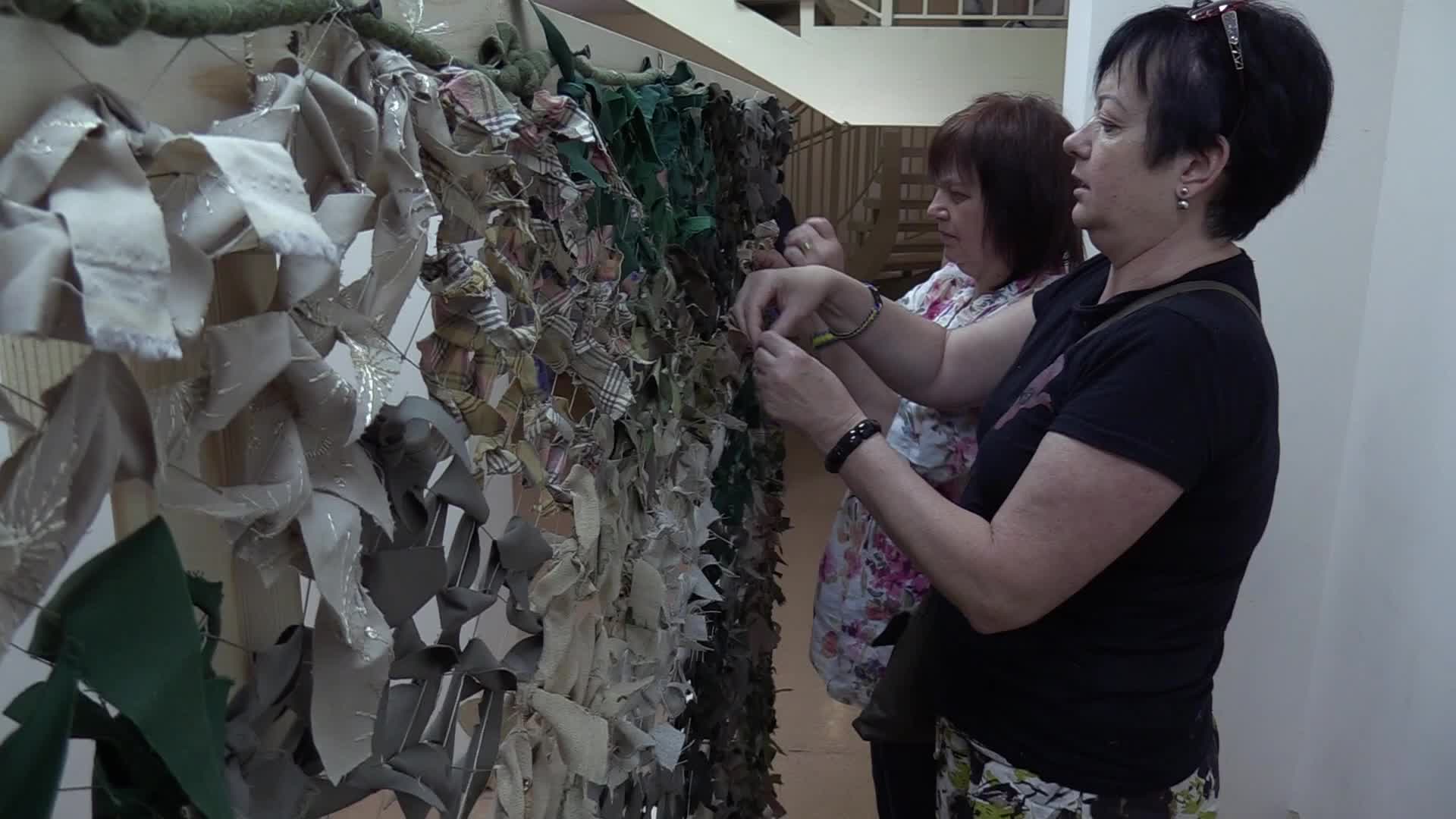 Women weave camouflage nets for Ukrainian armed forces in Odesa, amid Russian invasion in Ukraine
