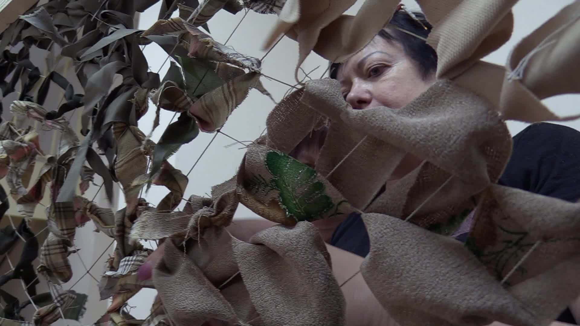 Women weave camouflage nets for Ukrainian armed forces in Odesa, amid Russian invasion in Ukraine