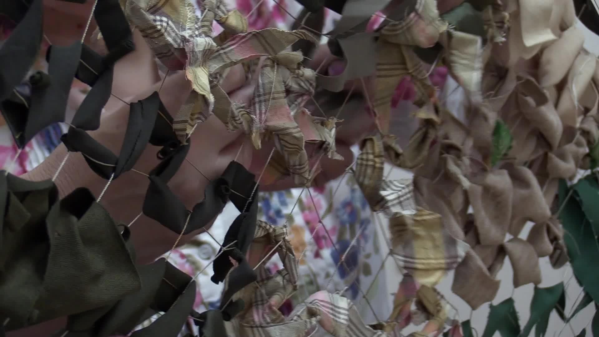 Women weave camouflage nets for Ukrainian armed forces in Odesa, amid Russian invasion in Ukraine