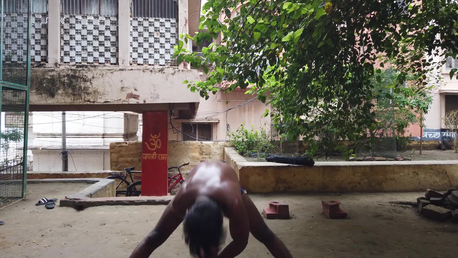 Kushti players doing tradition exercise with wodden club at Tulsi Ghat Akhada