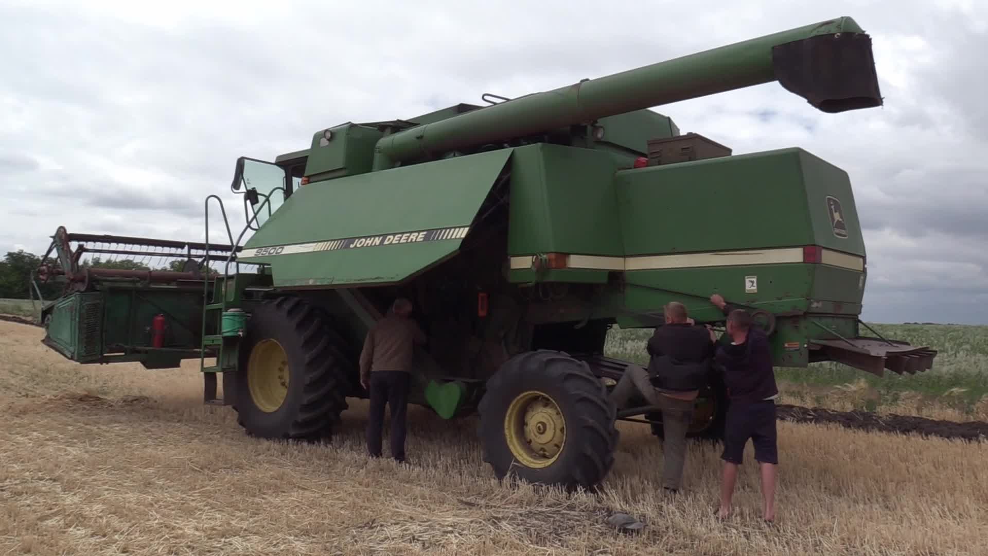 Ukrainian farmers harvesting grain of winter barley in Odesa region, amid Russia's invasion of Ukraine