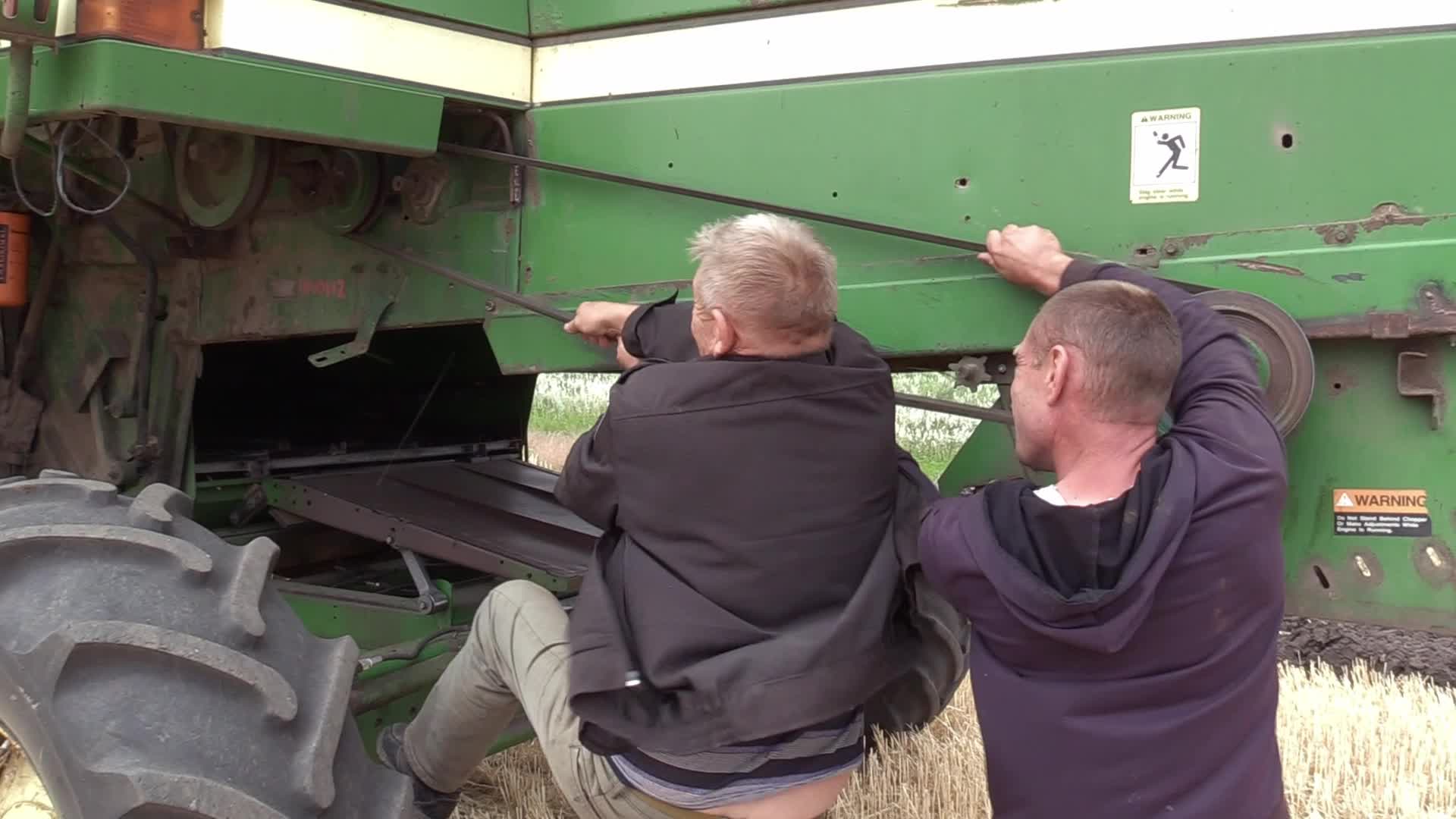Ukrainian farmers harvesting grain of winter barley in Odesa region, amid Russia's invasion of Ukraine