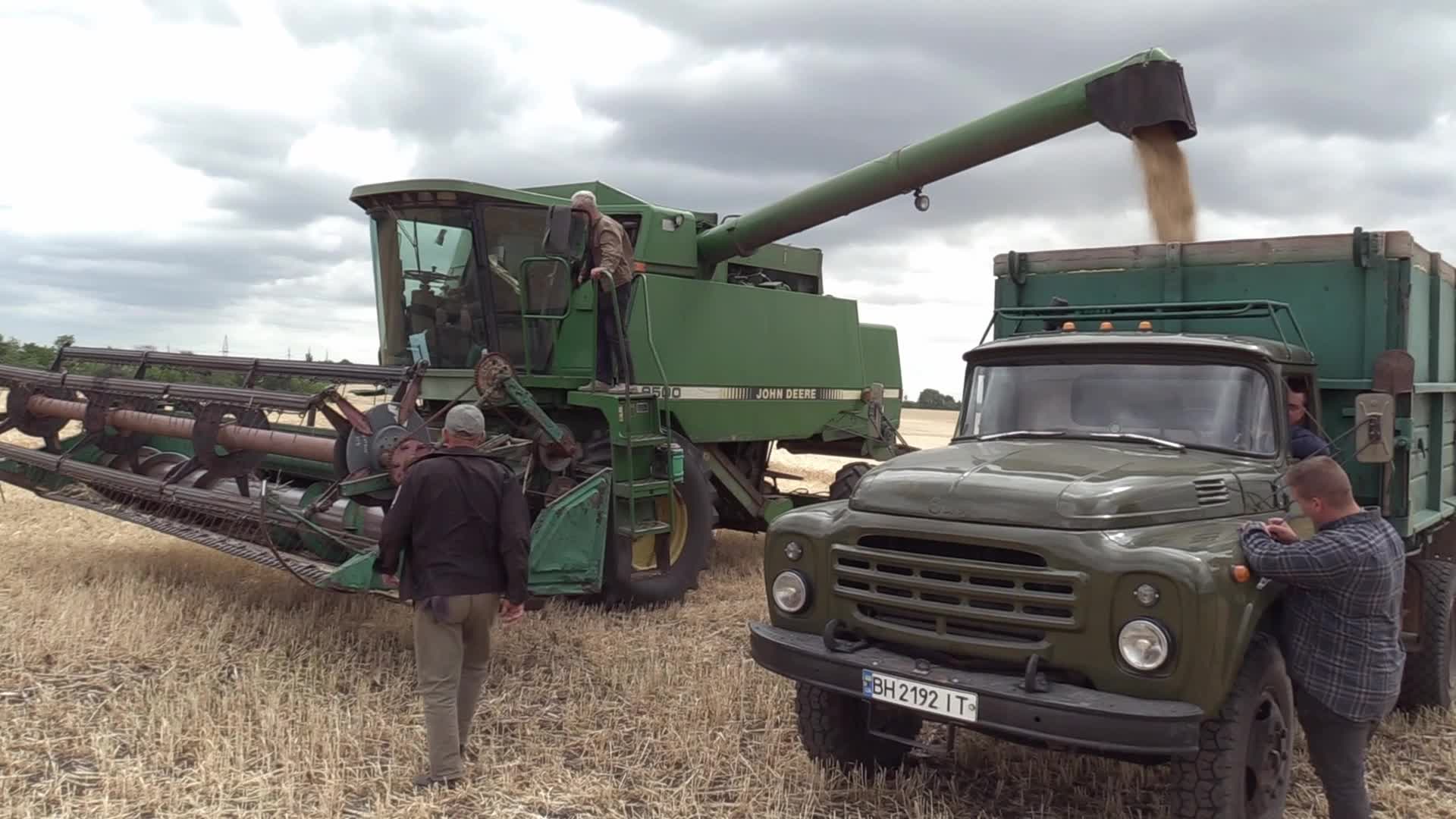 Ukrainian farmers harvesting grain of winter barley in Odesa region, amid Russia's invasion of Ukraine