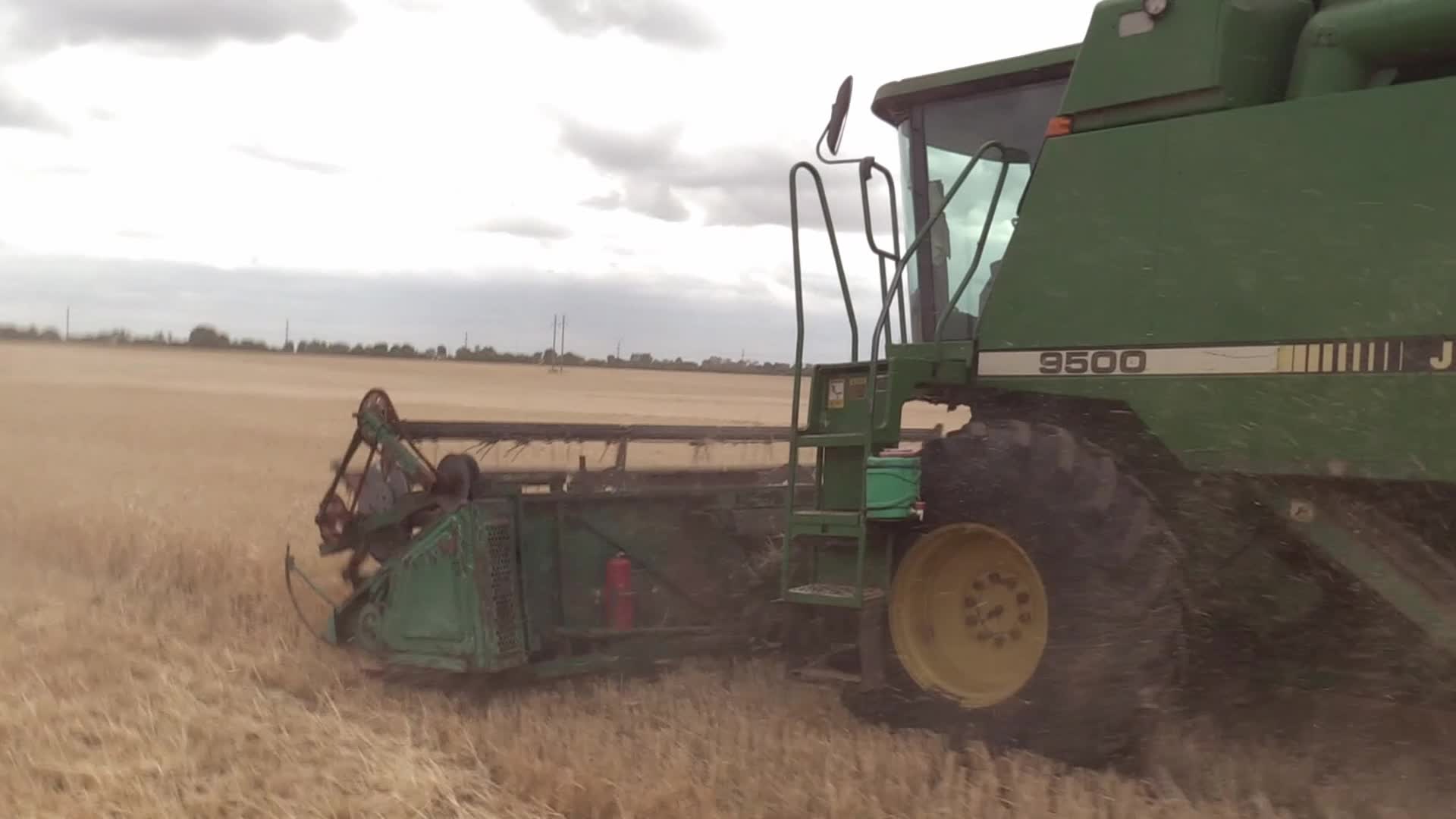 Ukrainian farmers harvesting grain of winter barley in Odesa region, amid Russia's invasion of Ukraine