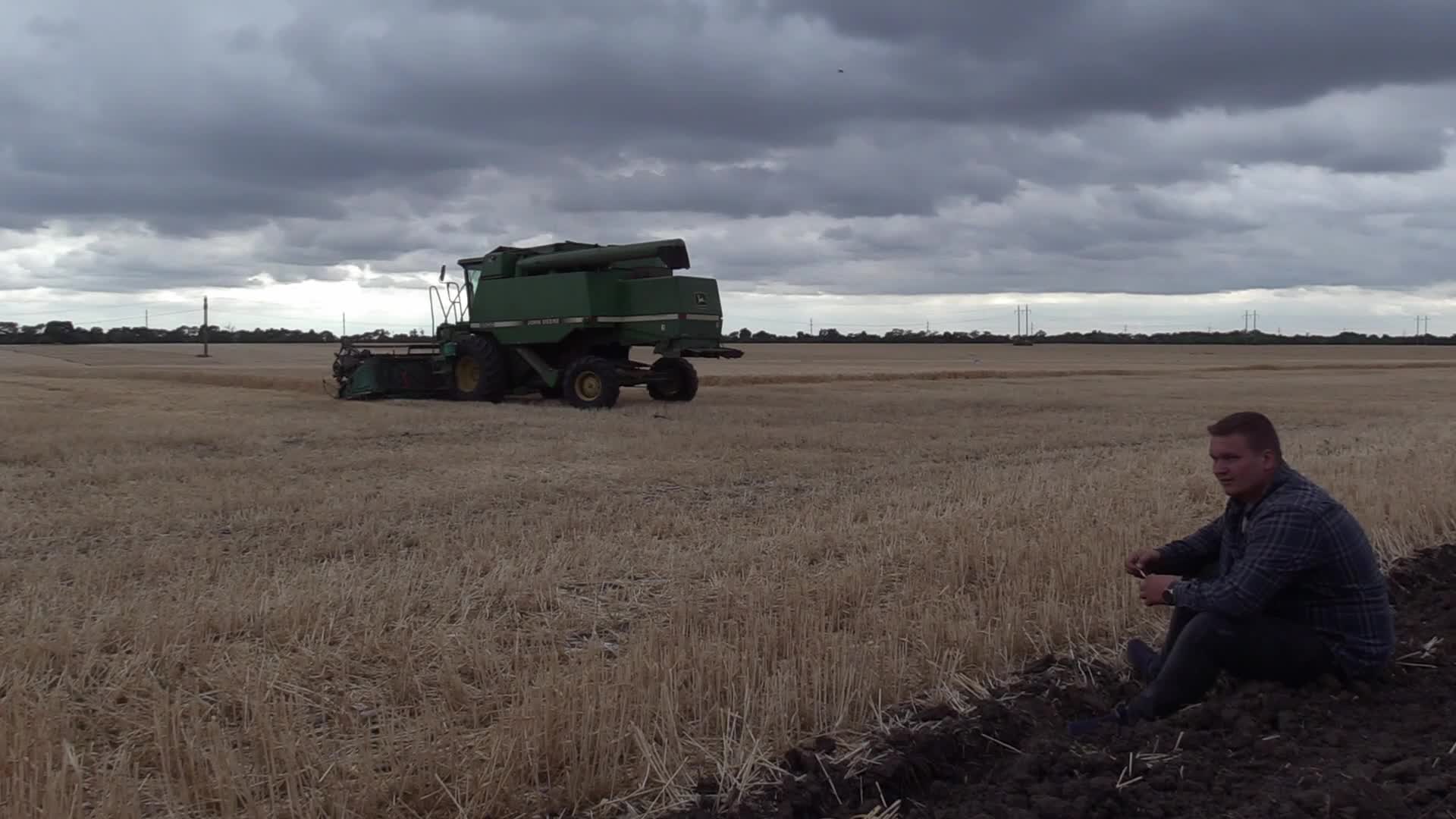 Ukrainian farmers harvesting grain of winter barley in Odesa region, amid Russia's invasion of Ukraine