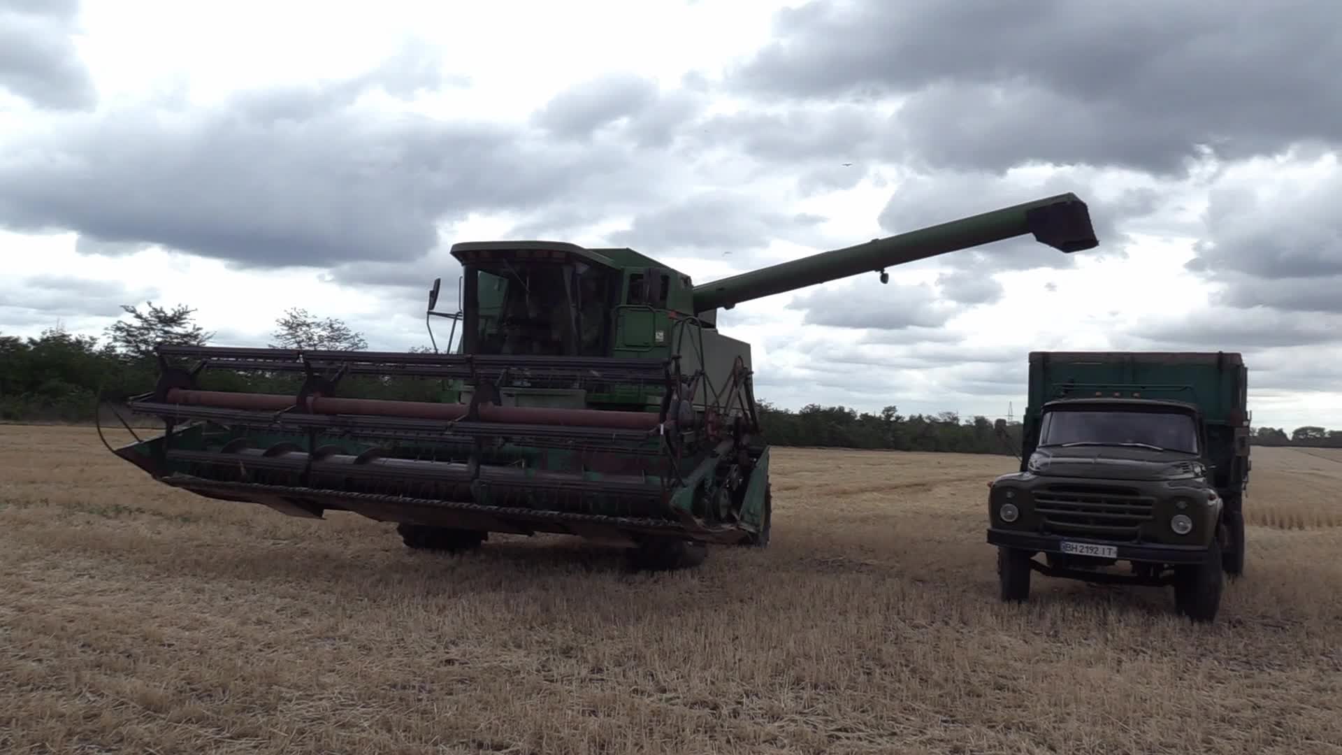 Ukrainian farmers harvesting grain of winter barley in Odesa region, amid Russia's invasion of Ukraine