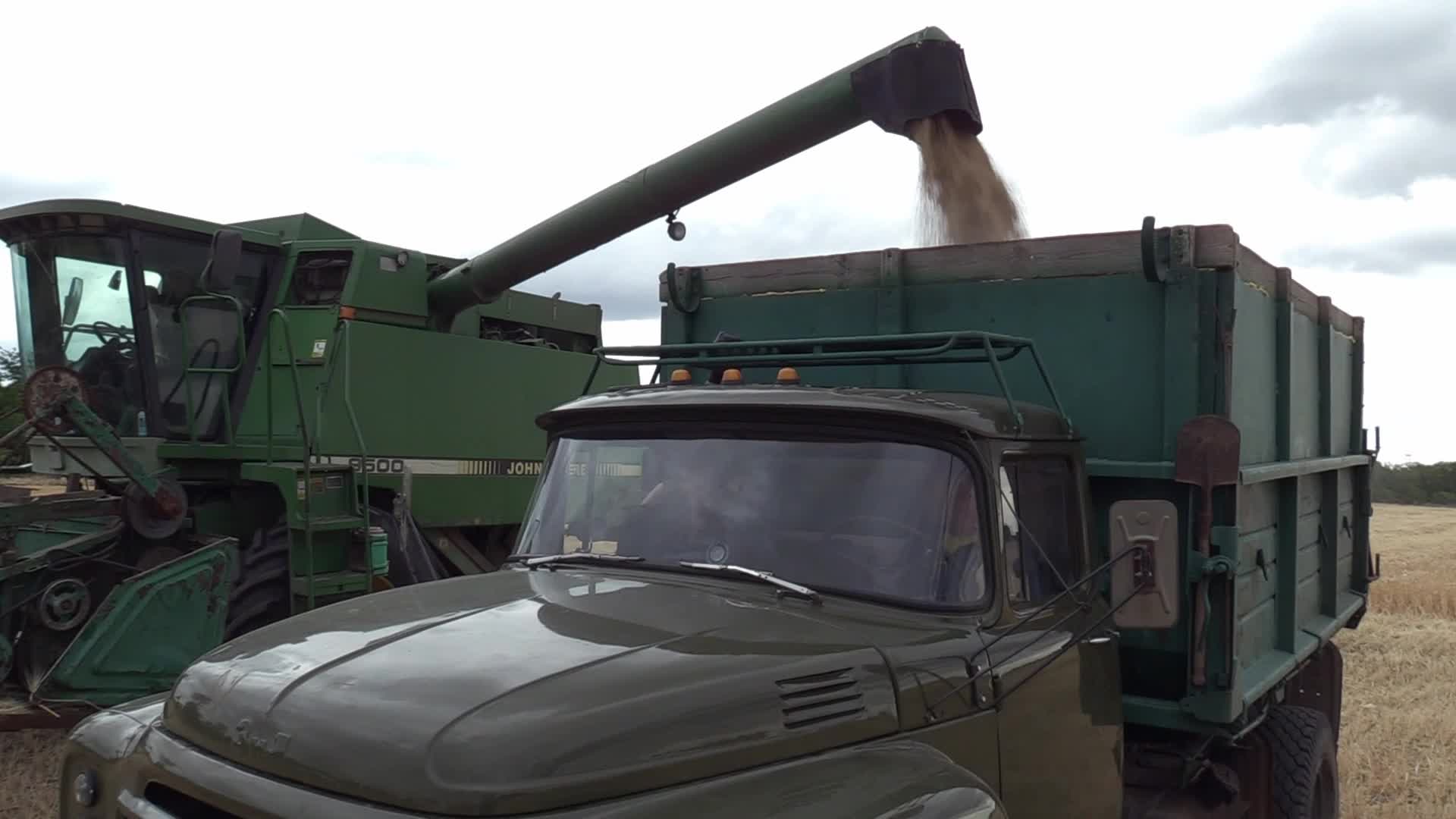 Ukrainian farmers harvesting grain of winter barley in Odesa region, amid Russia's invasion of Ukraine