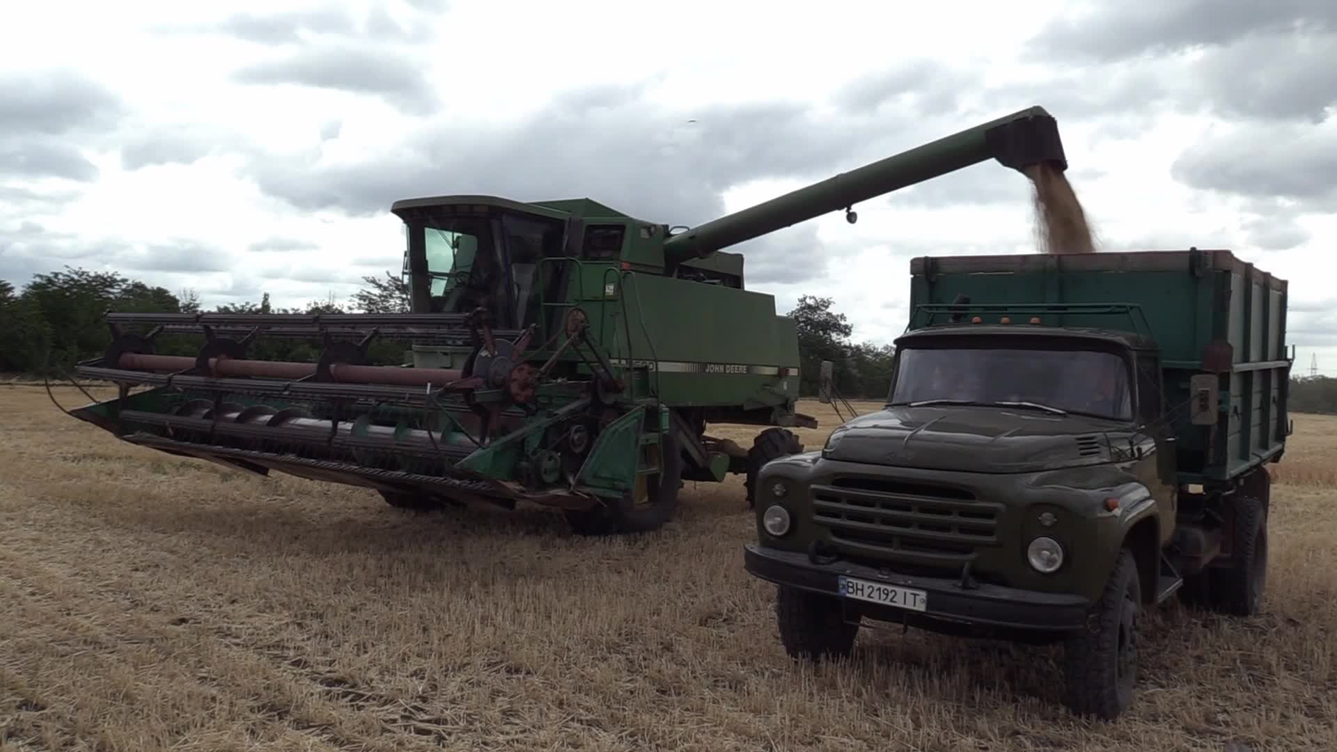 Ukrainian farmers harvesting grain of winter barley in Odesa region, amid Russia's invasion of Ukraine