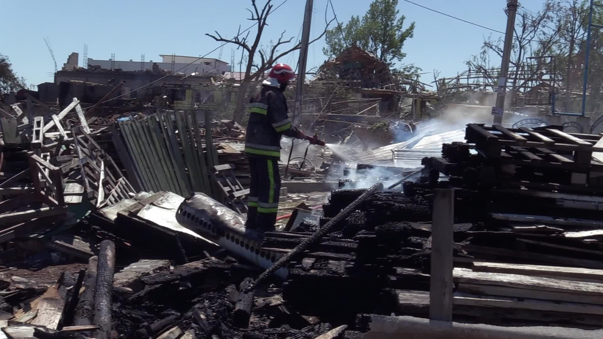 Ukrainian rescuers work at a site of a rocket strike in Odesa region, amid Russia's invasion of Ukraine