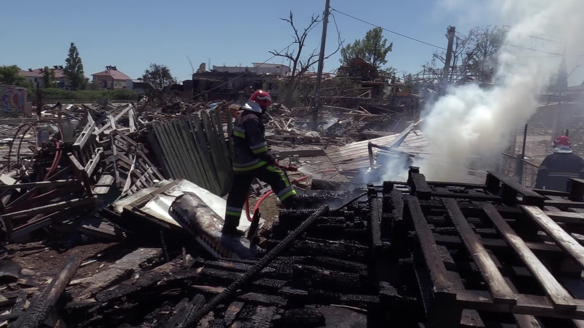 Ukrainian rescuers work at a site of a rocket strike in Odesa region, amid Russia's invasion of Ukraine