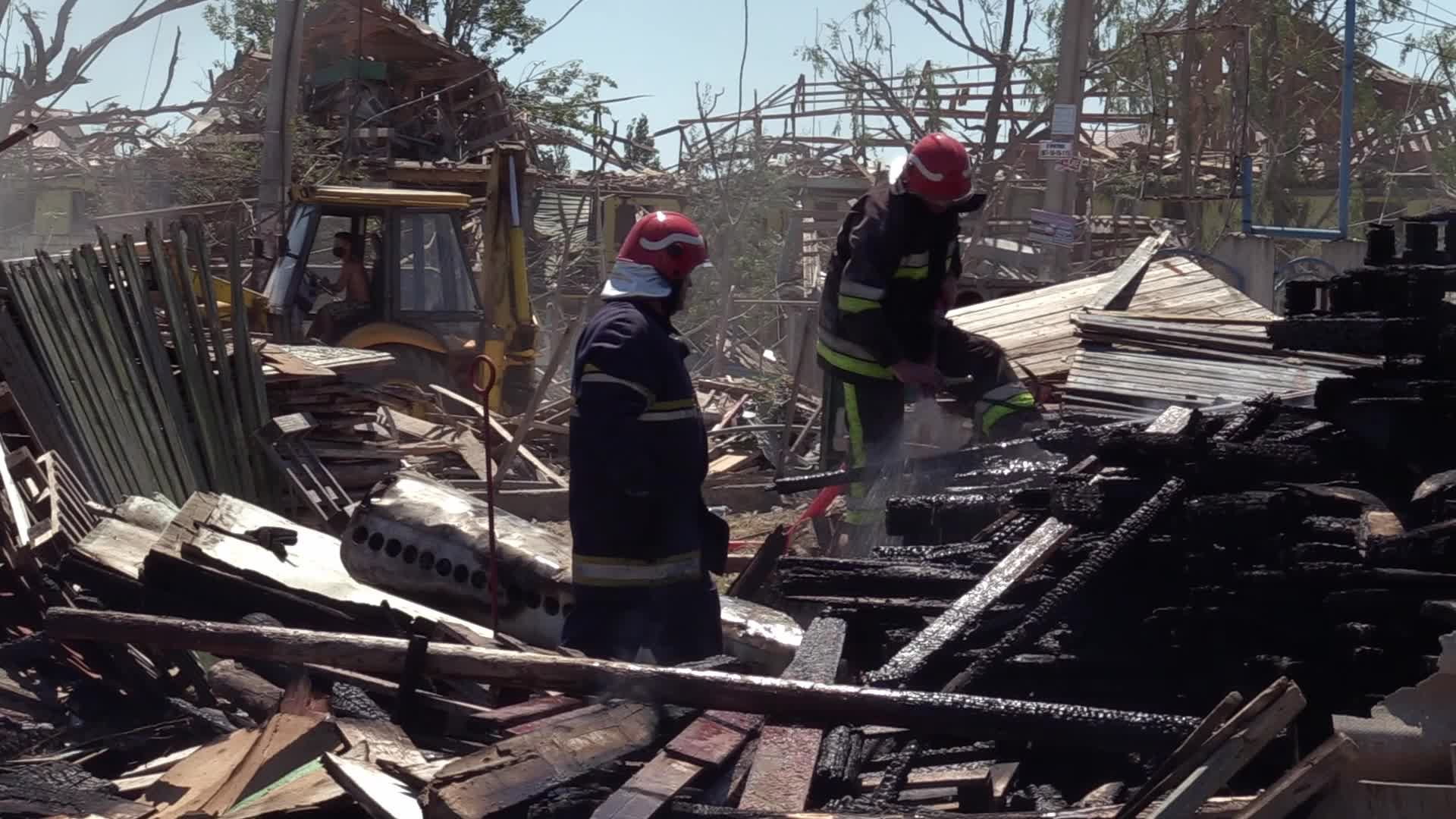 Ukrainian rescuers work at a site of a rocket strike in Odesa region, amid Russia's invasion of Ukraine