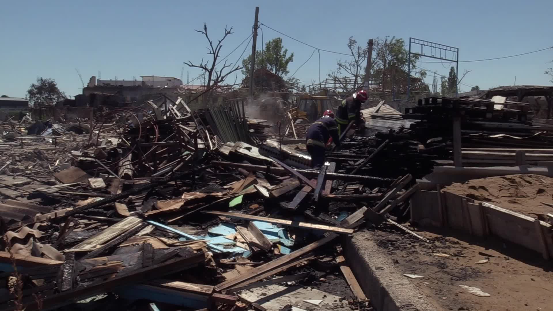 Ukrainian rescuers work at a site of a rocket strike in Odesa region, amid Russia's invasion of Ukraine