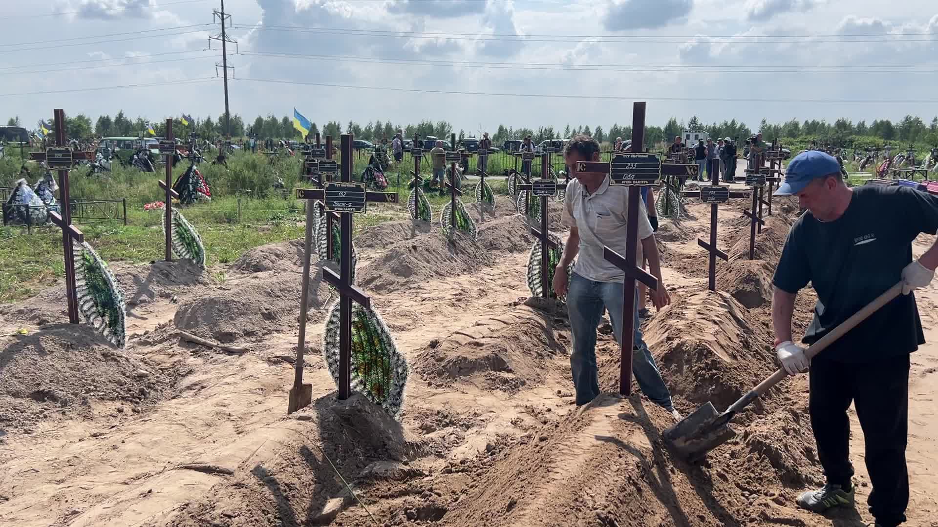 Mass burial of unidentified people killed during Russian invasion in Bucha 