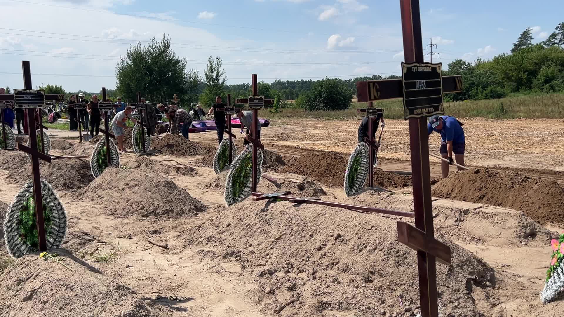 Mass burial of unidentified people killed during Russian invasion in Bucha 