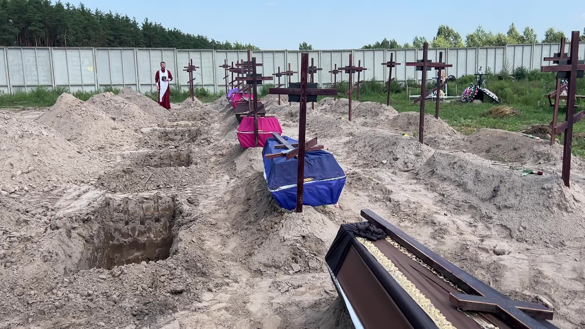 Mass burial of unidentified people killed during Russian invasion in Bucha 
